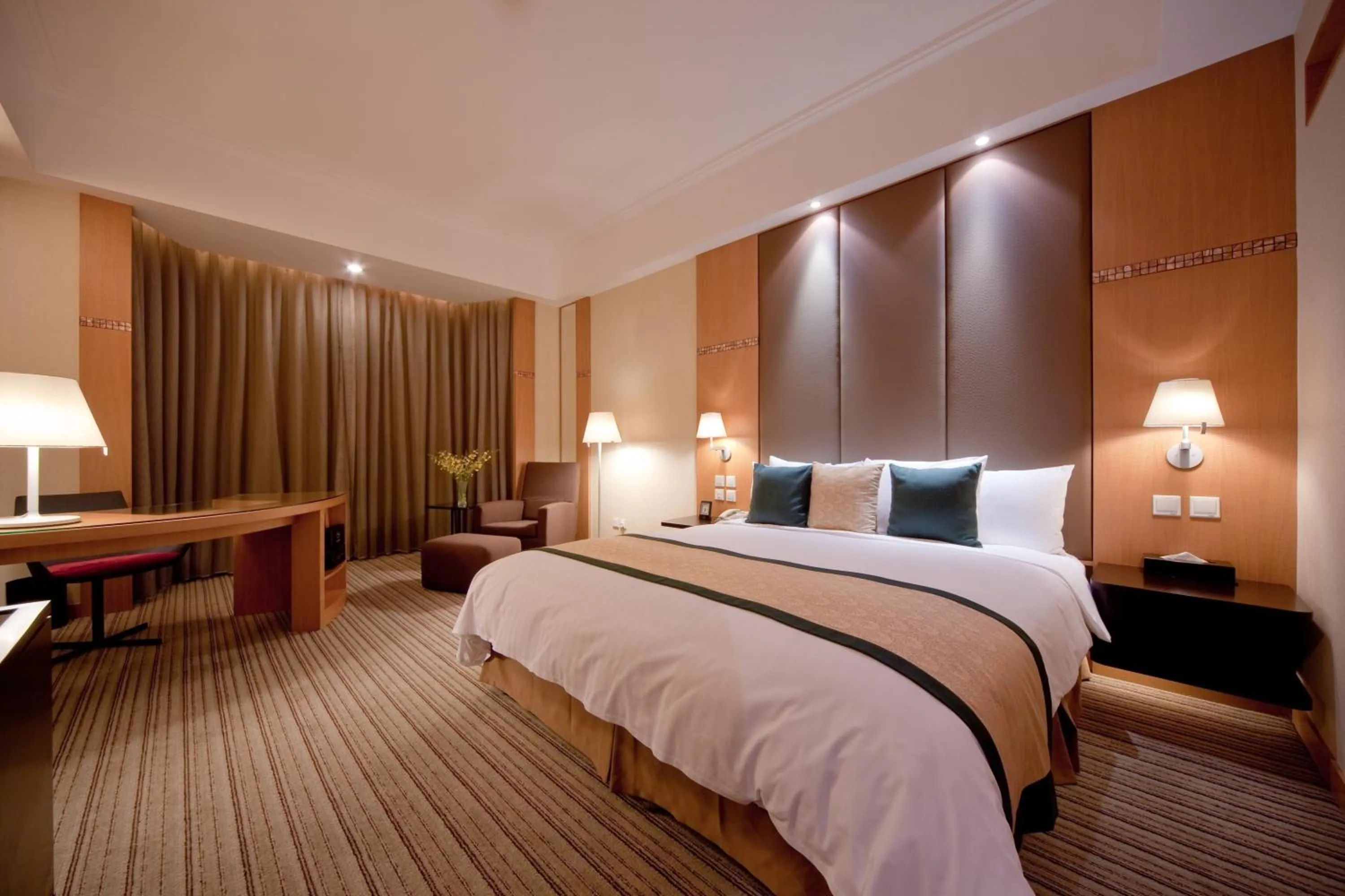 Bed in New World Shunde Hotel