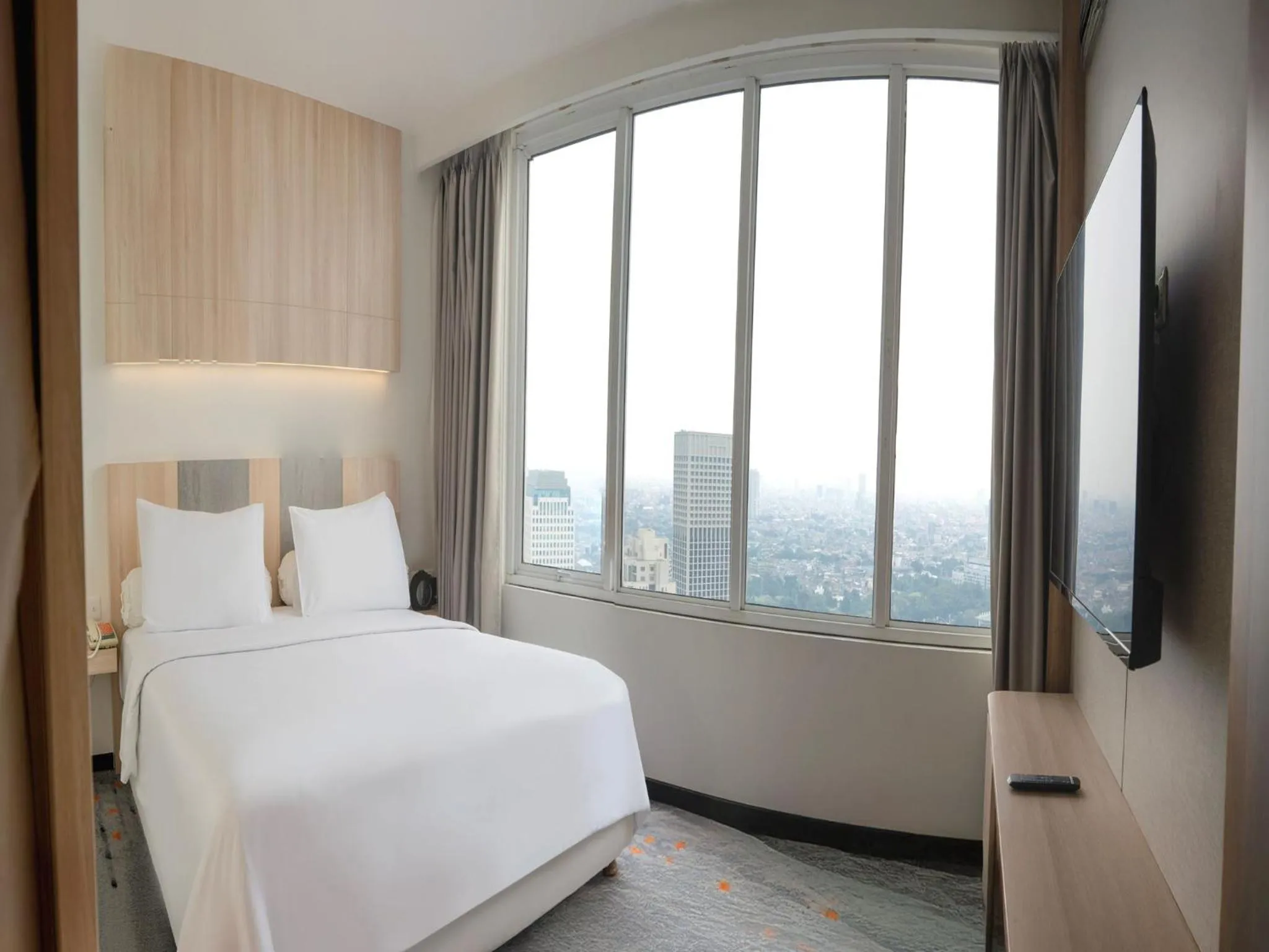 Bedroom, Bed in HARRIS Suites fx Sudirman