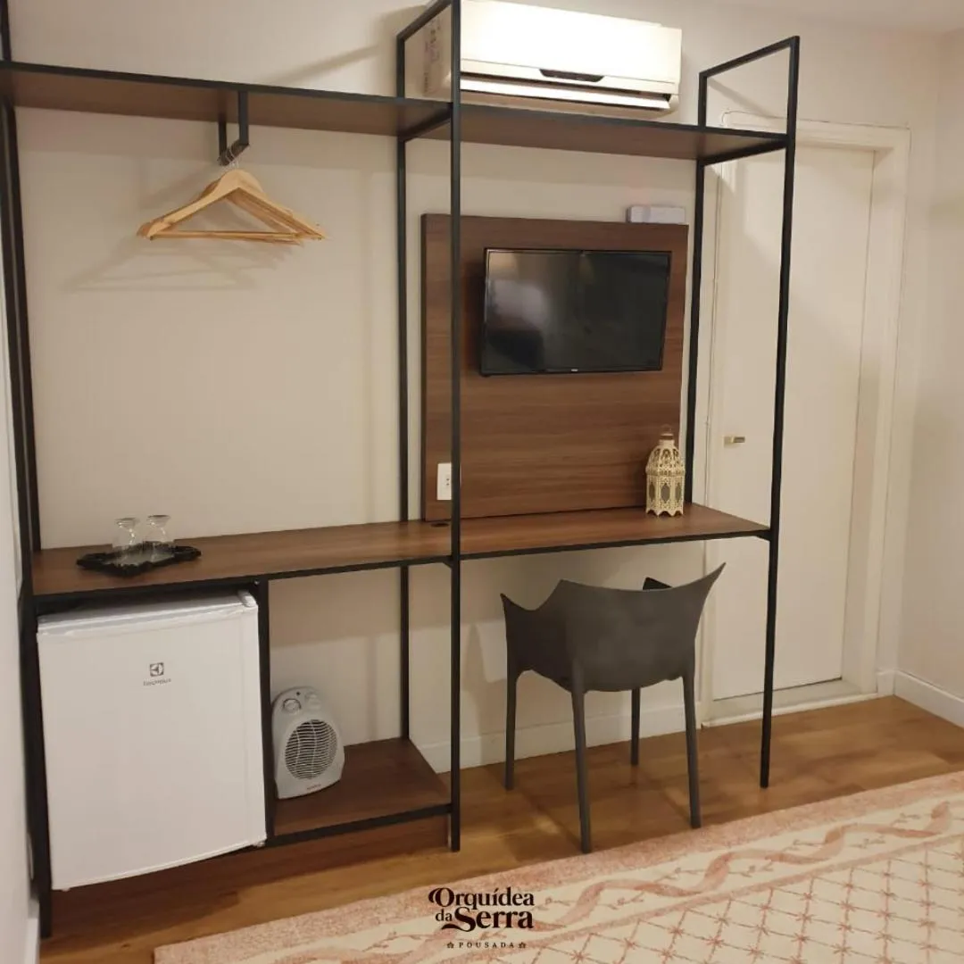 TV and multimedia in Pousada Orquidea da Serra