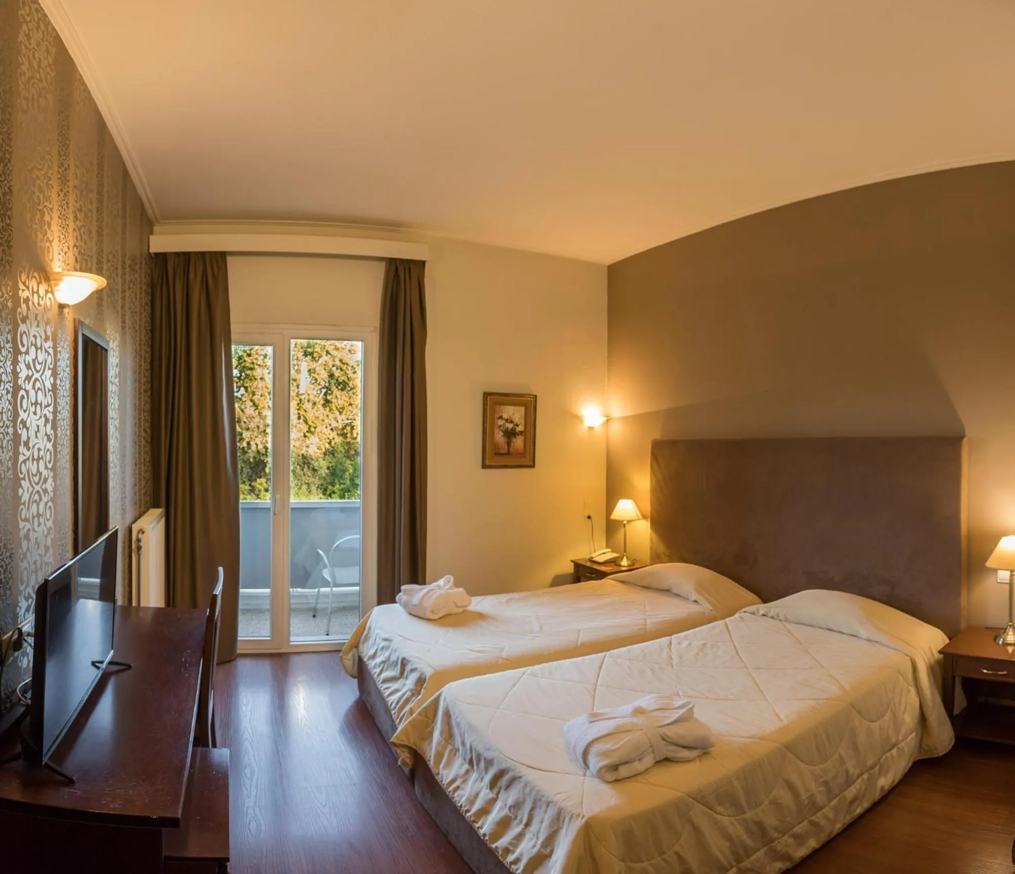 Bed in Achillion Hotel