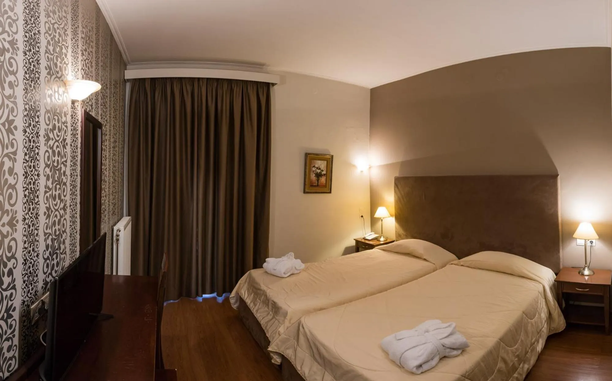 Bed in Achillion Hotel