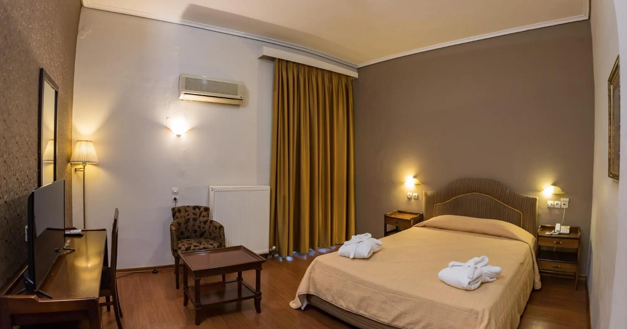 Bed in Achillion Hotel