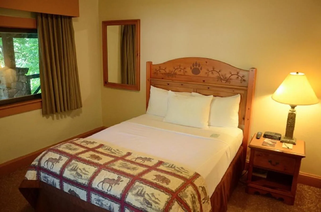 Shower, Bed in Overlook Lodge and Stone Cottages at Bear Mountain