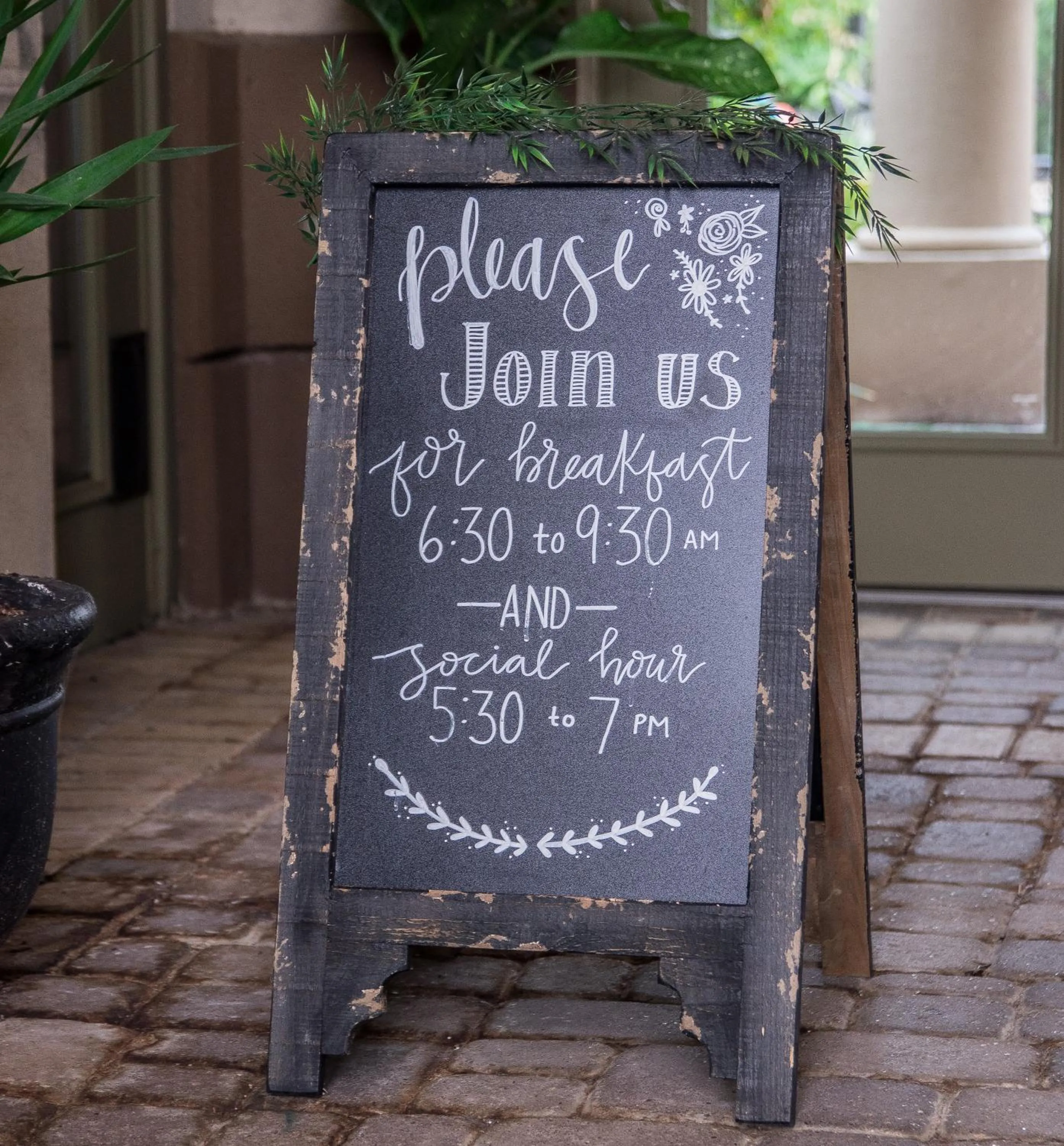 Property logo or sign in Vineyard Court Designer Suites Hotel