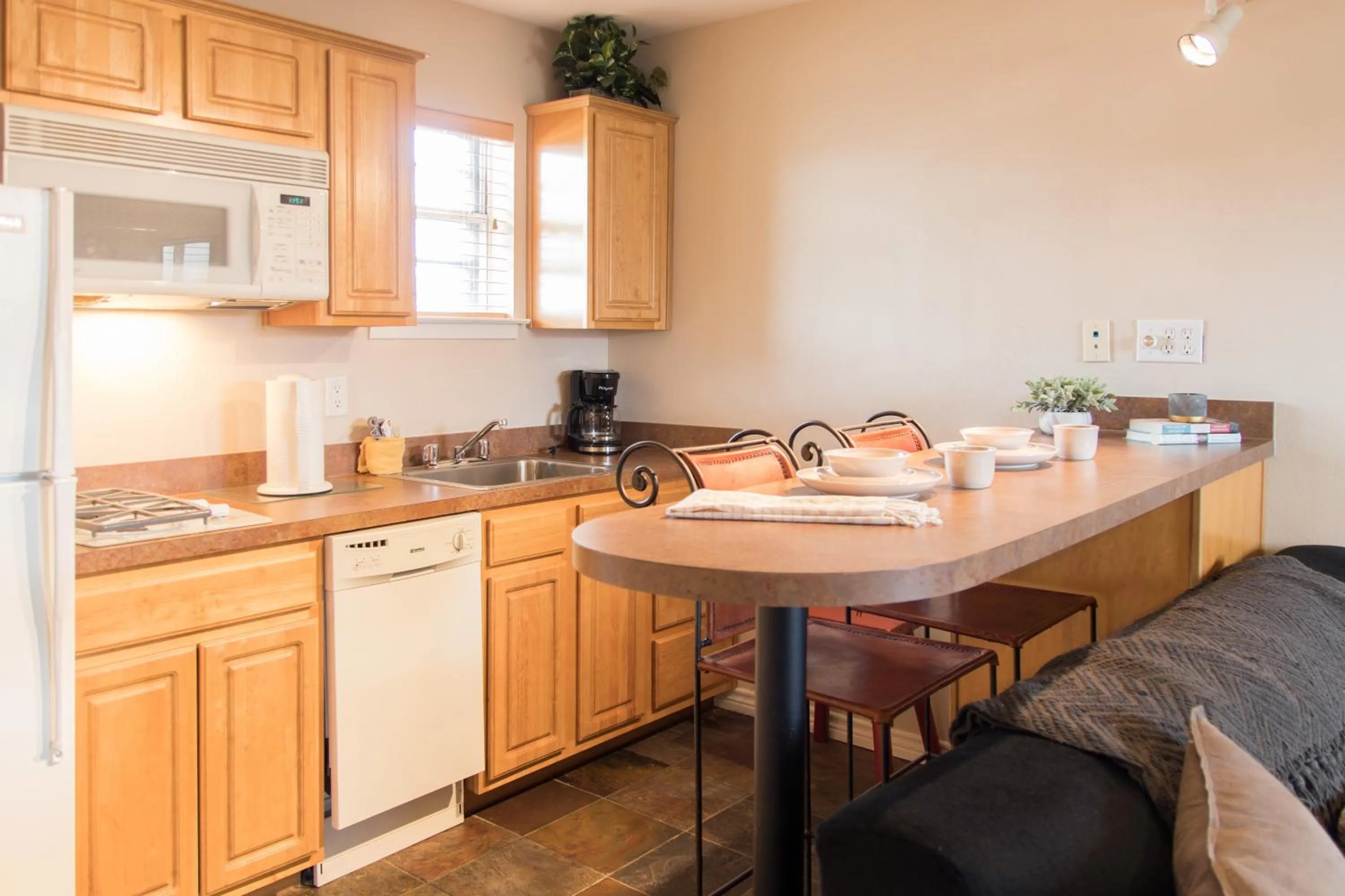 Kitchen or kitchenette in Vineyard Court Designer Suites Hotel