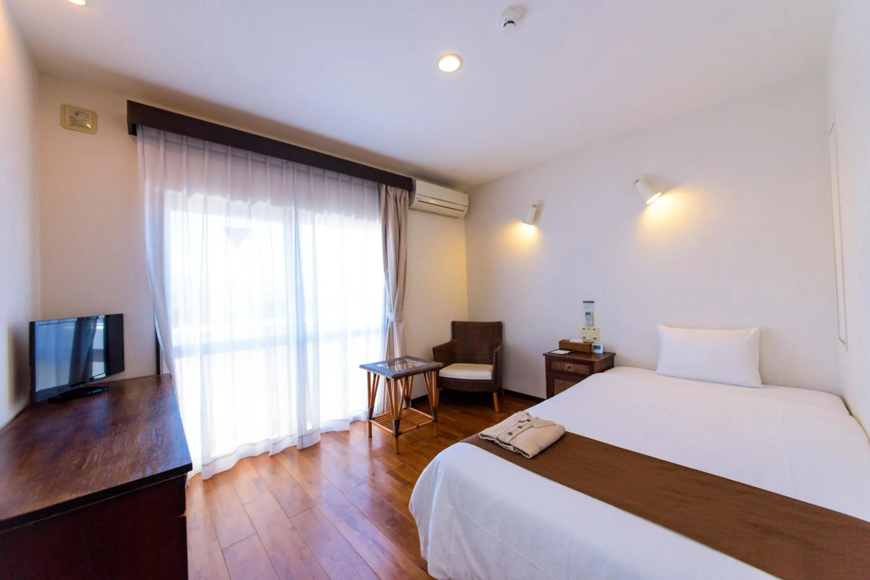 Photo of the whole room, Bed in Hotel Patina Ishigakijima