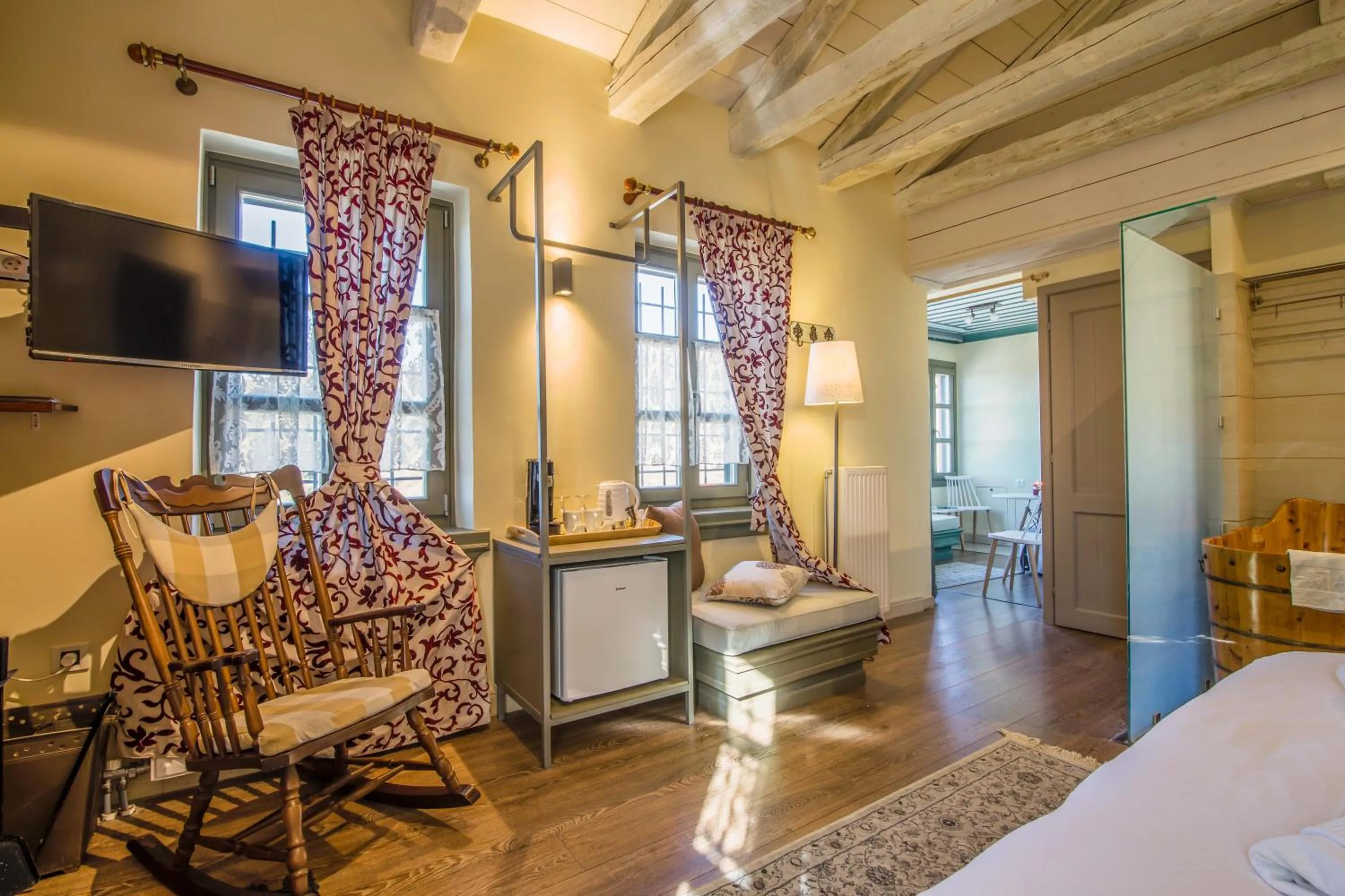 Seating area, Bed in Pirrion Wellness Boutique Hotel