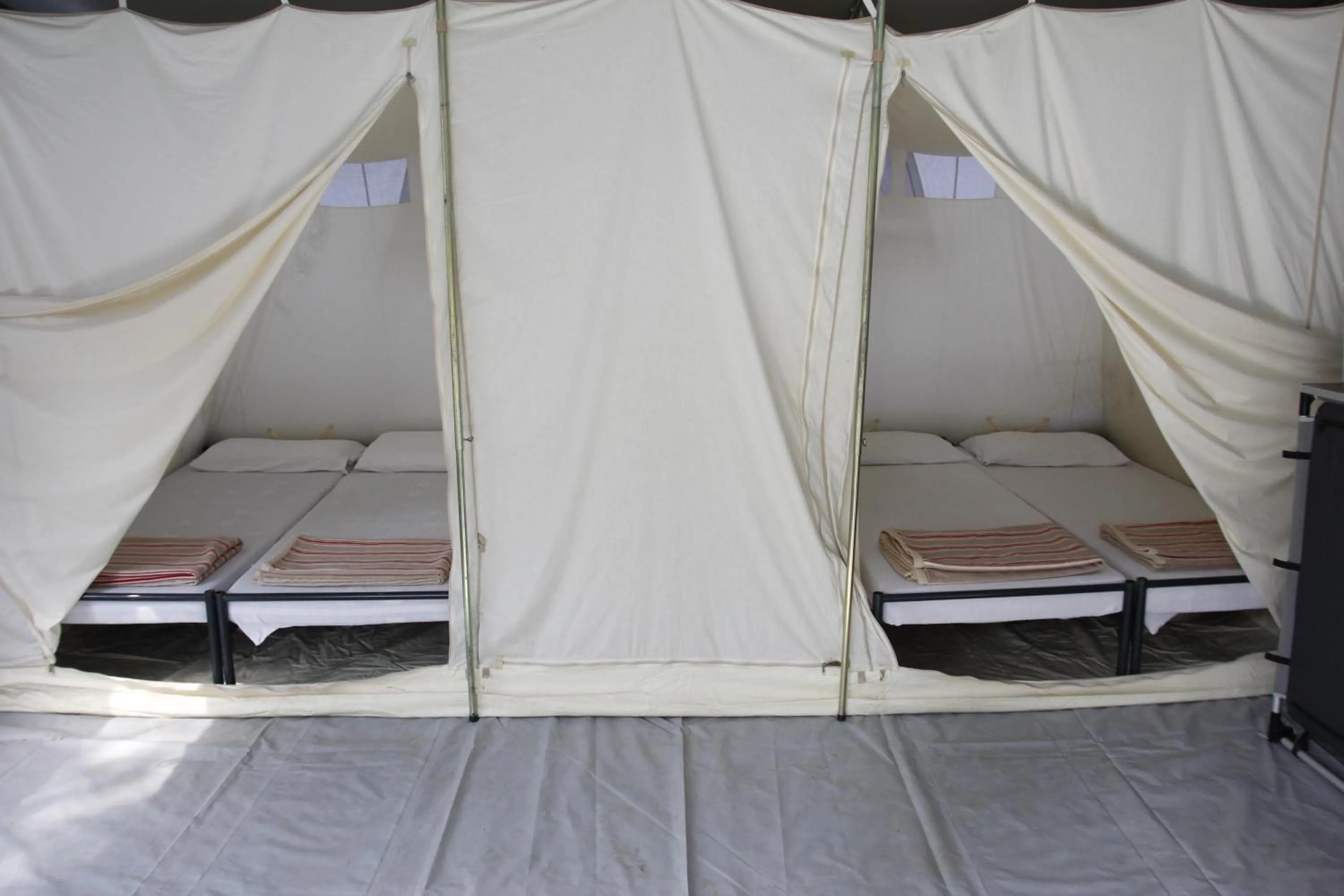 Decorative detail, Bed in Camping Village Canapai