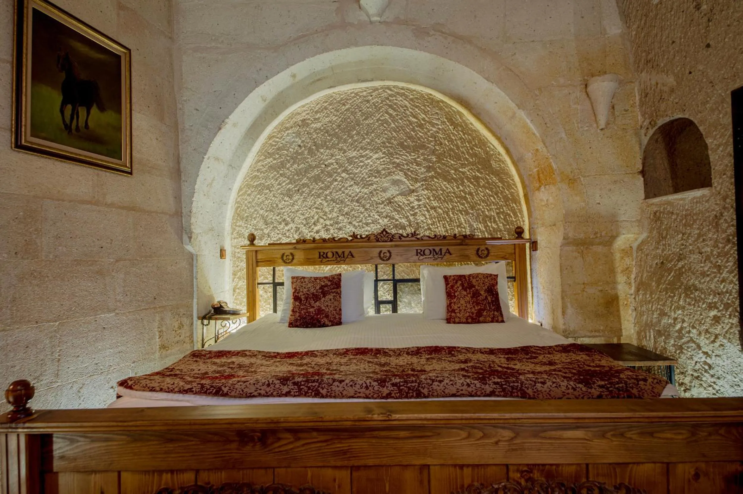 Bed in Roma Cave Suite