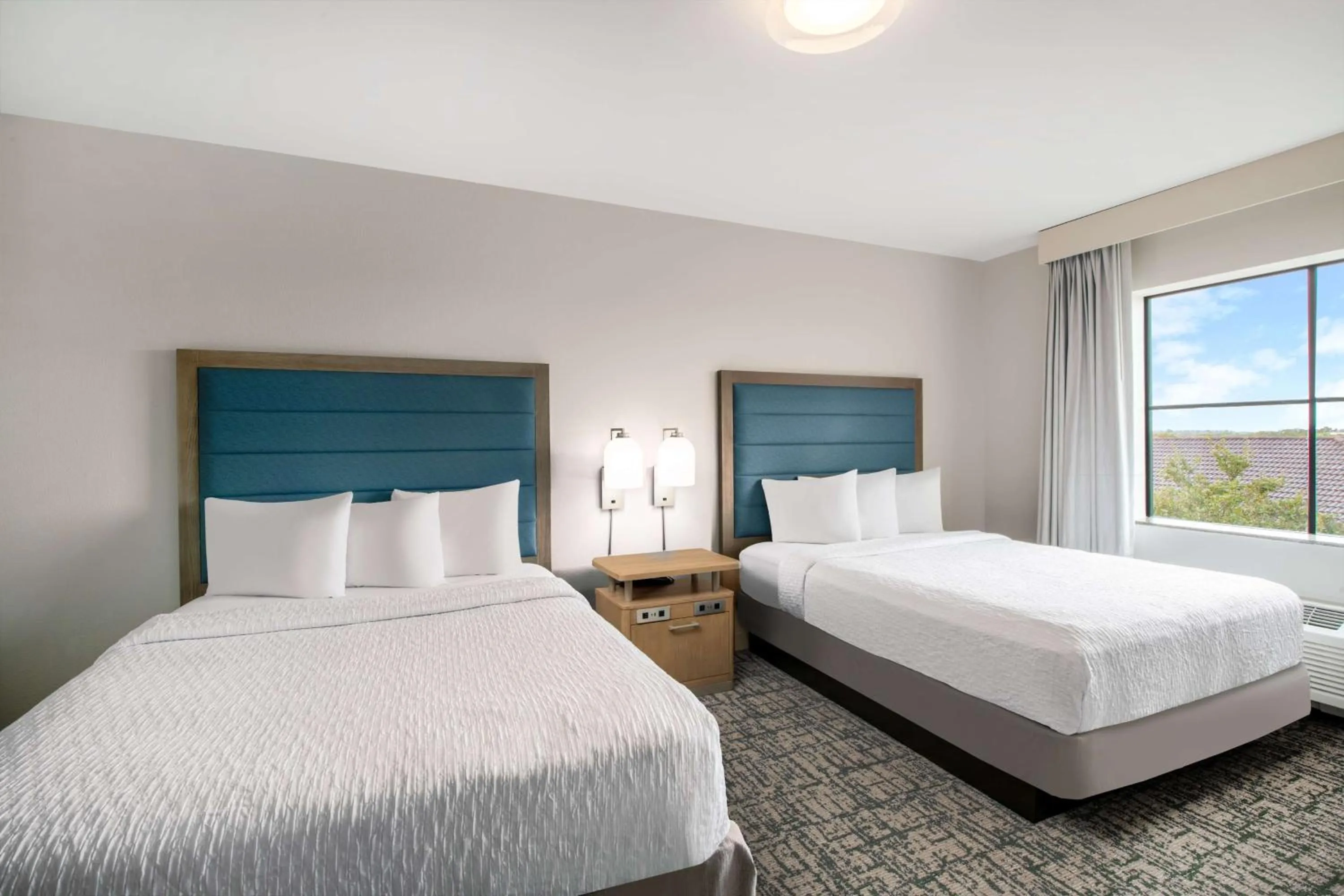 Bed in Homewood Suites by Hilton West Palm Beach