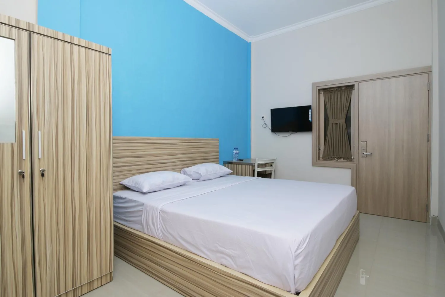 Bed in RedDoorz near Jalan Kolonel Haji Burlian Palembang