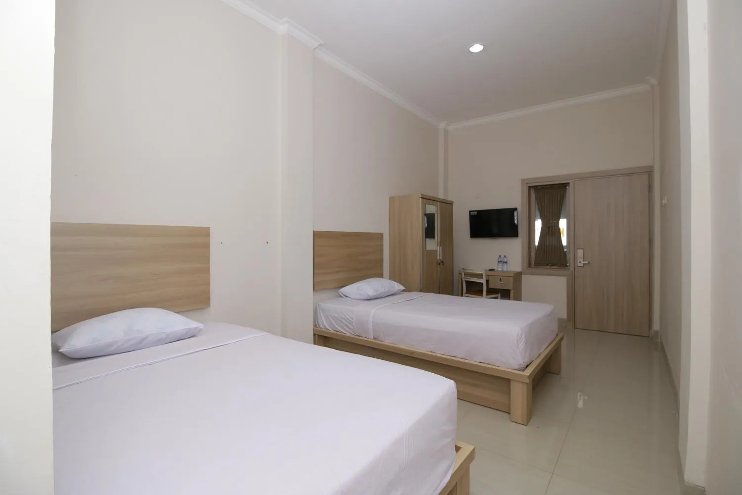 Bed in RedDoorz near Jalan Kolonel Haji Burlian Palembang