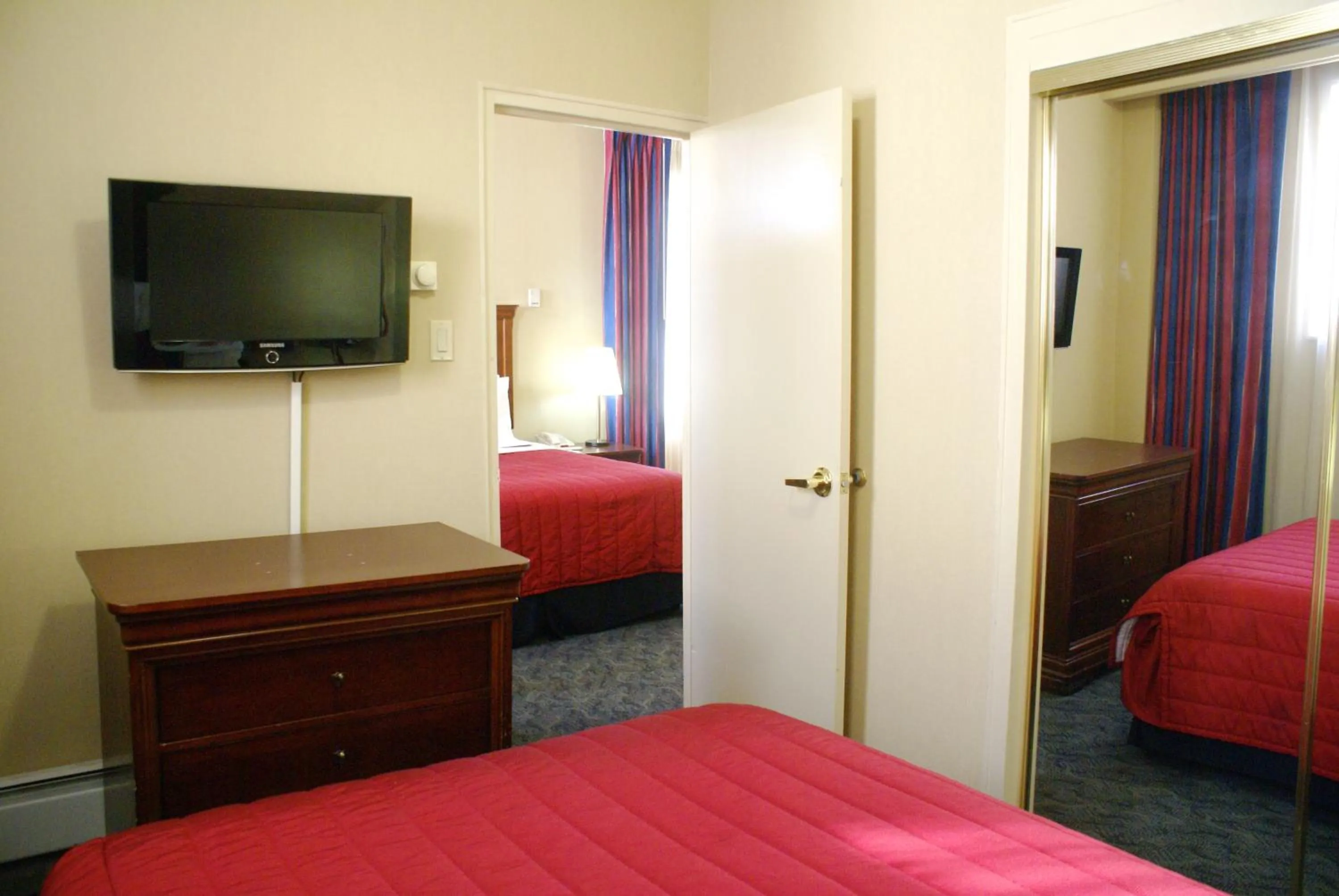 Bathroom, Bed in Ramada by Wyndham Jersey City