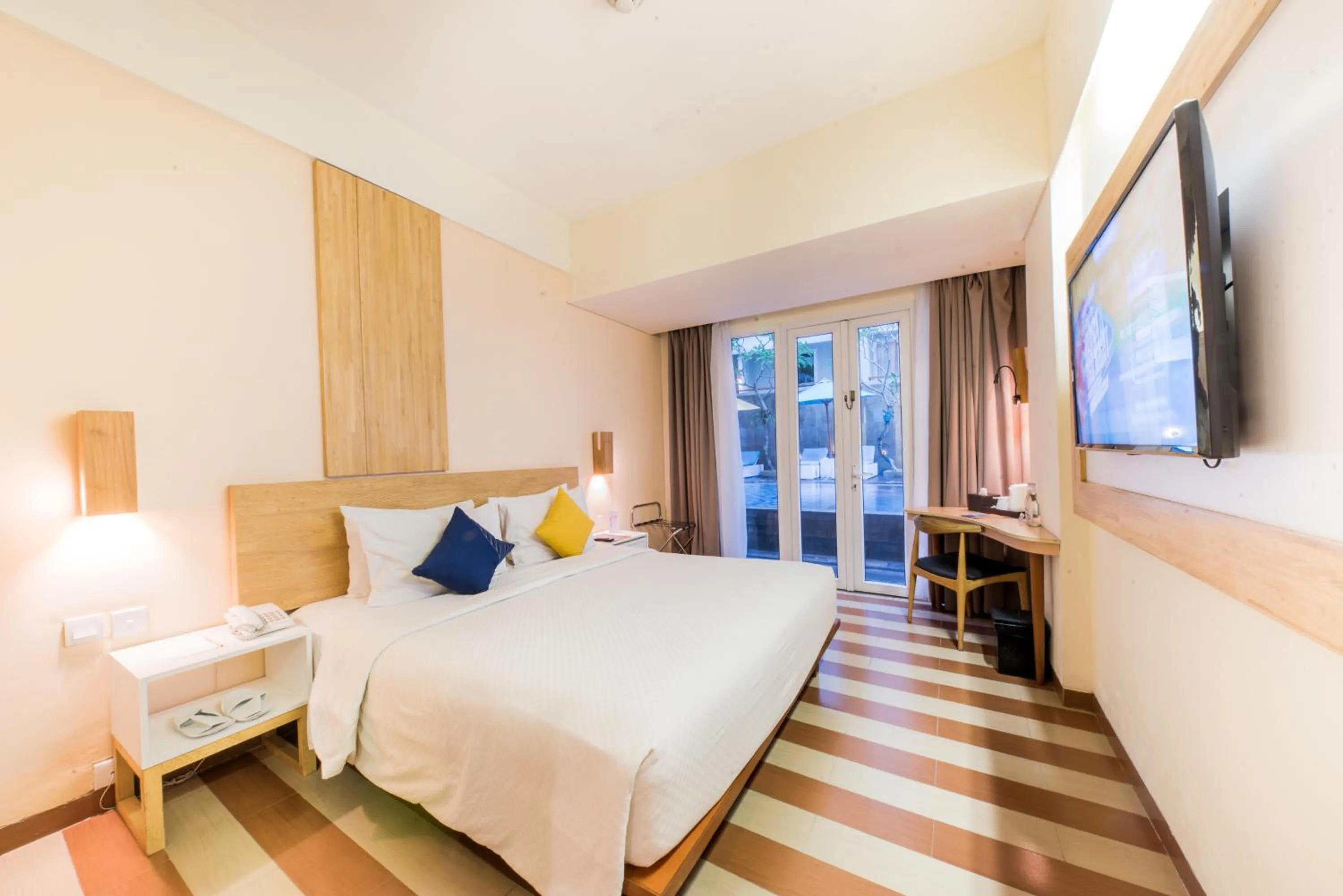 Communal lounge/ TV room, Bed in The ONE Legian