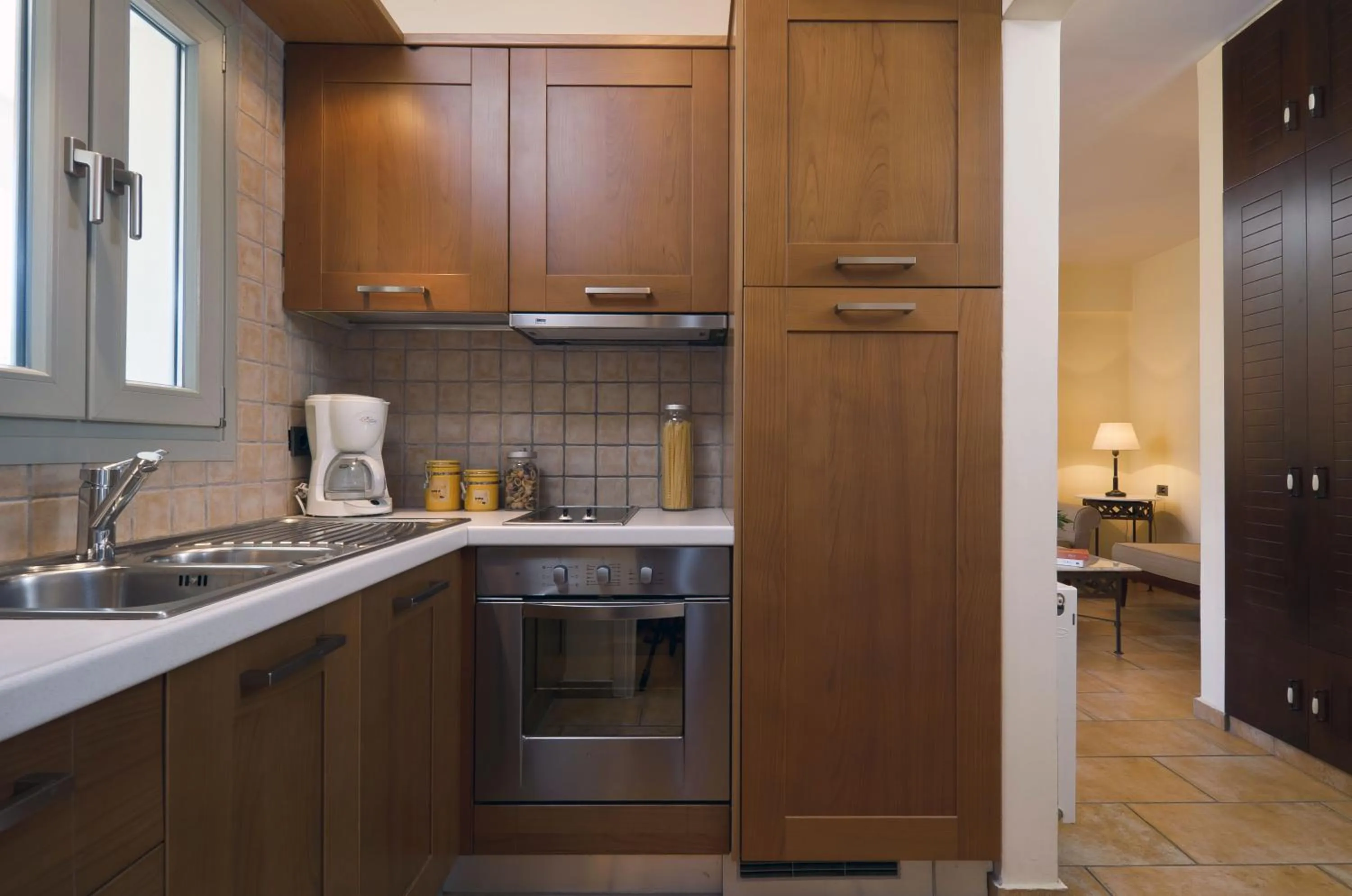 Kitchen or kitchenette in Harmony Hotel Apartments