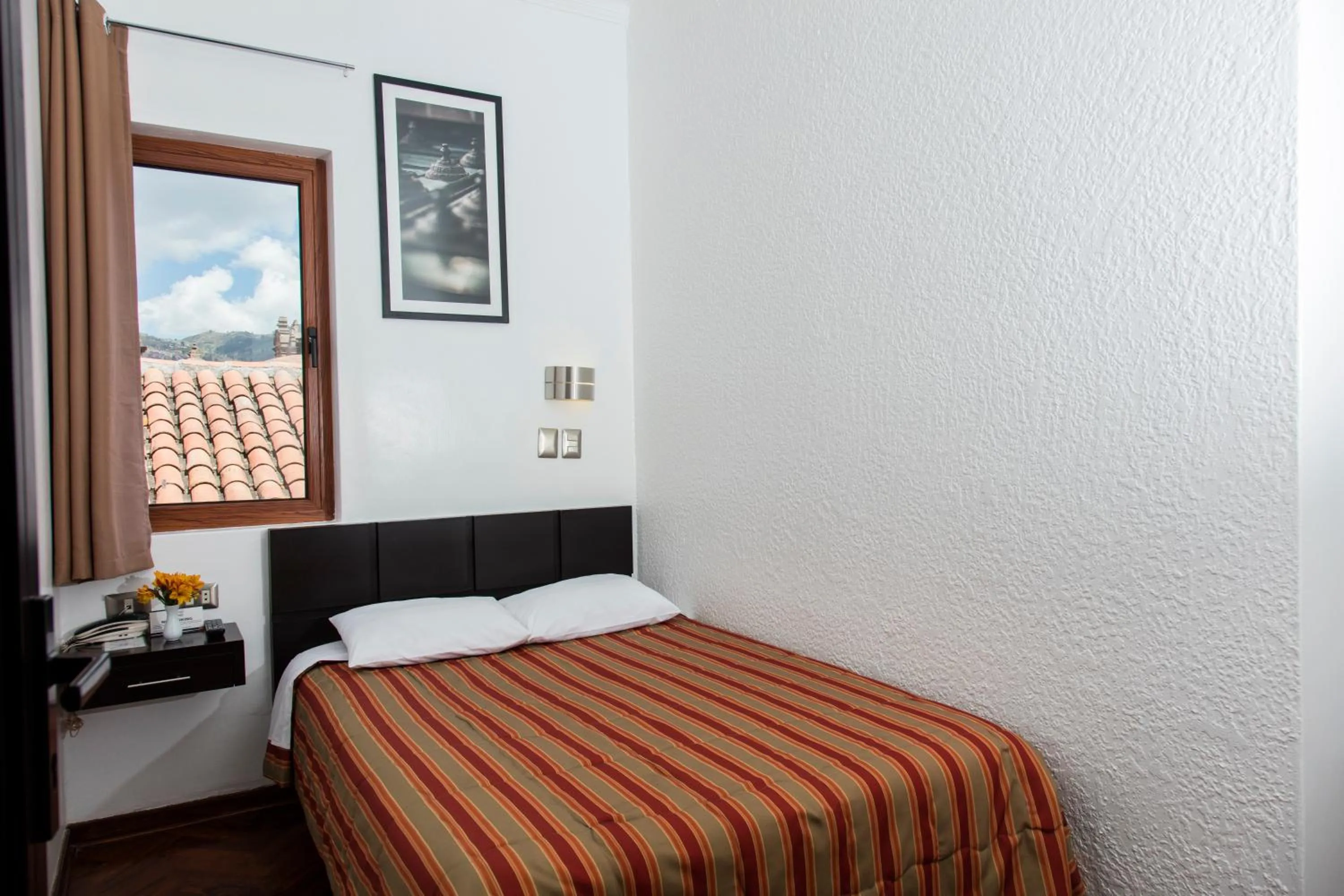 Photo of the whole room, Bed in Hostal & Apartments El Triunfo