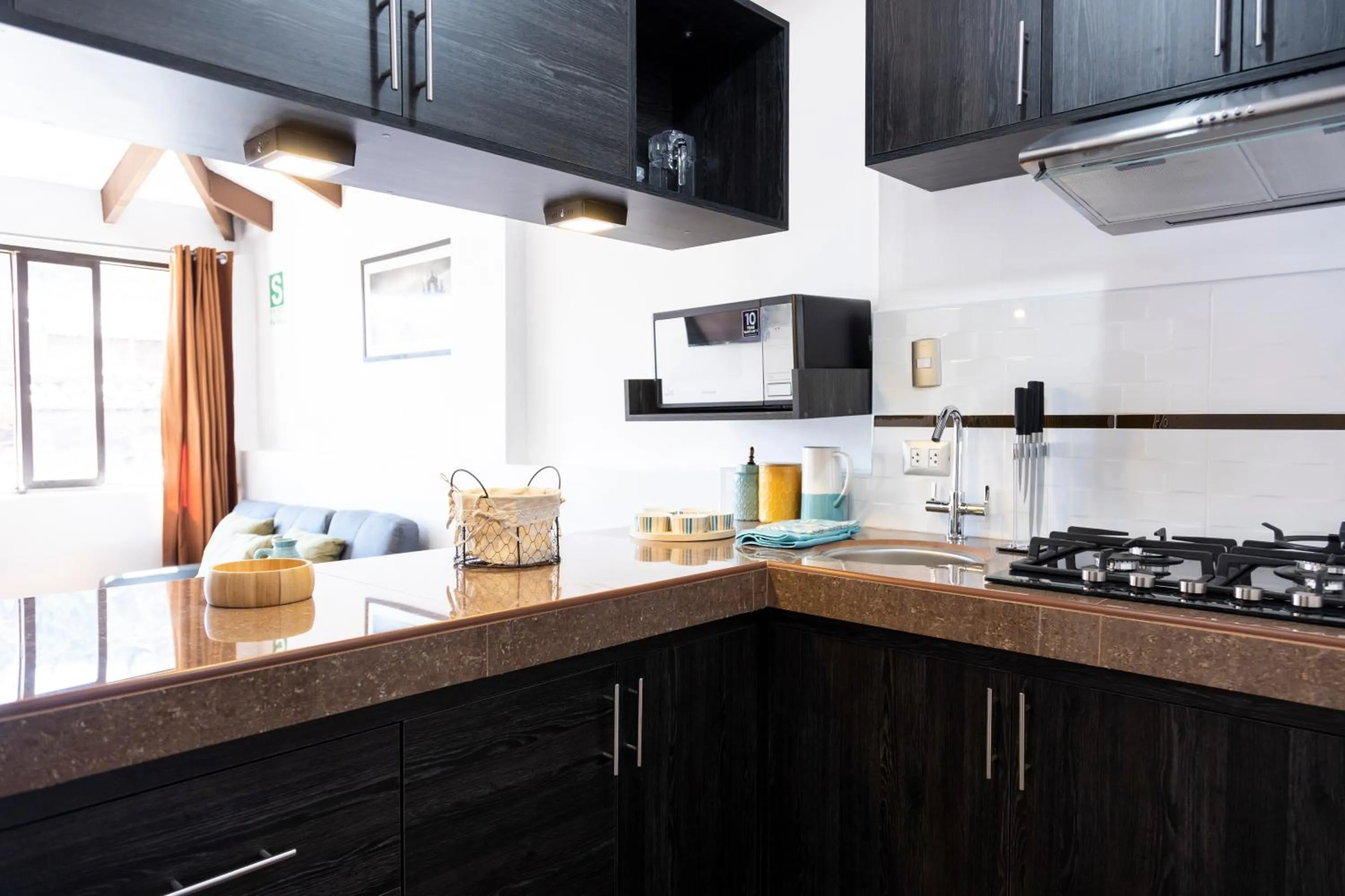 Kitchen or kitchenette in Hostal & Apartments El Triunfo