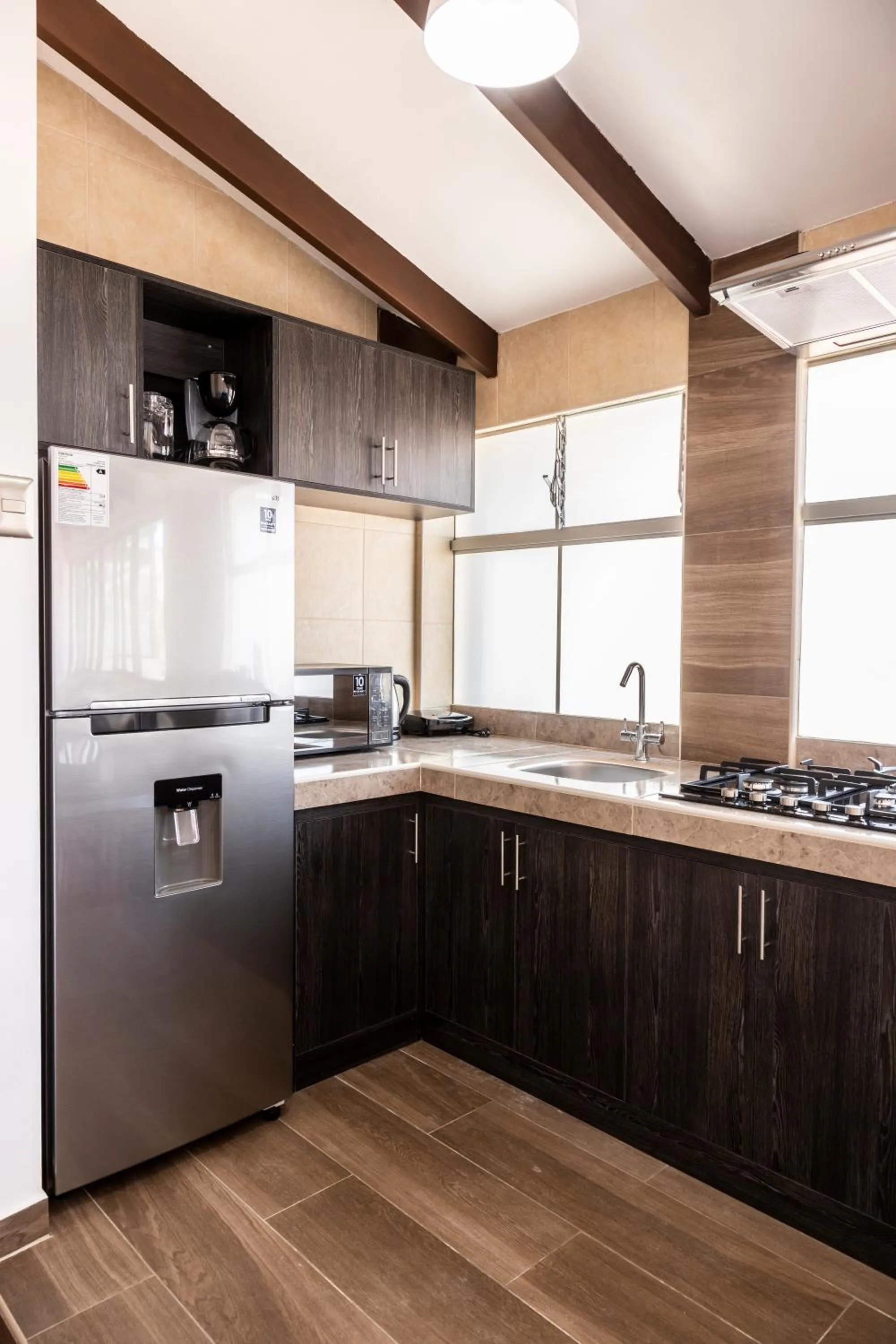 Kitchen or kitchenette in Hostal & Apartments El Triunfo