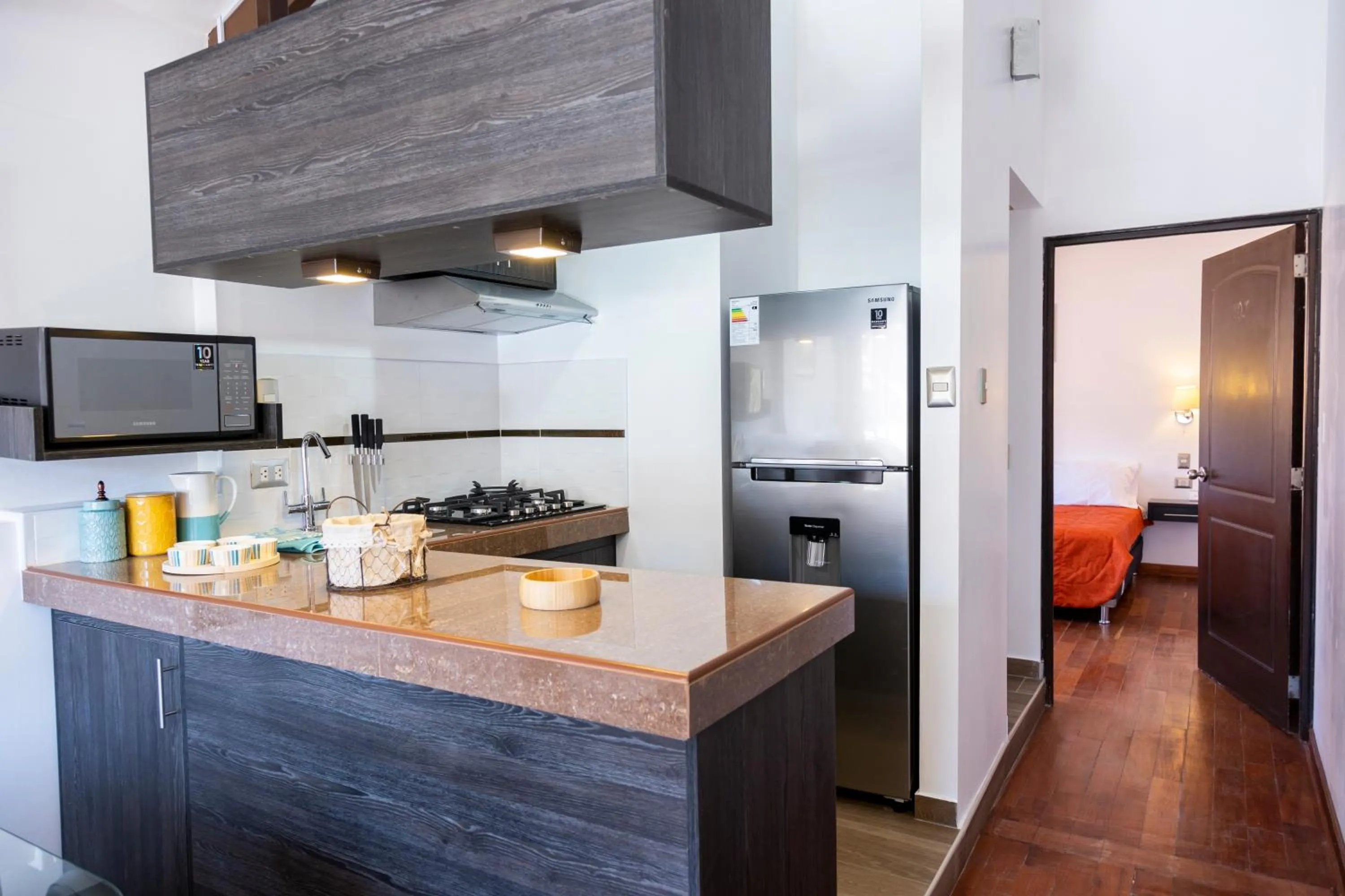 Kitchen or kitchenette in Hostal & Apartments El Triunfo