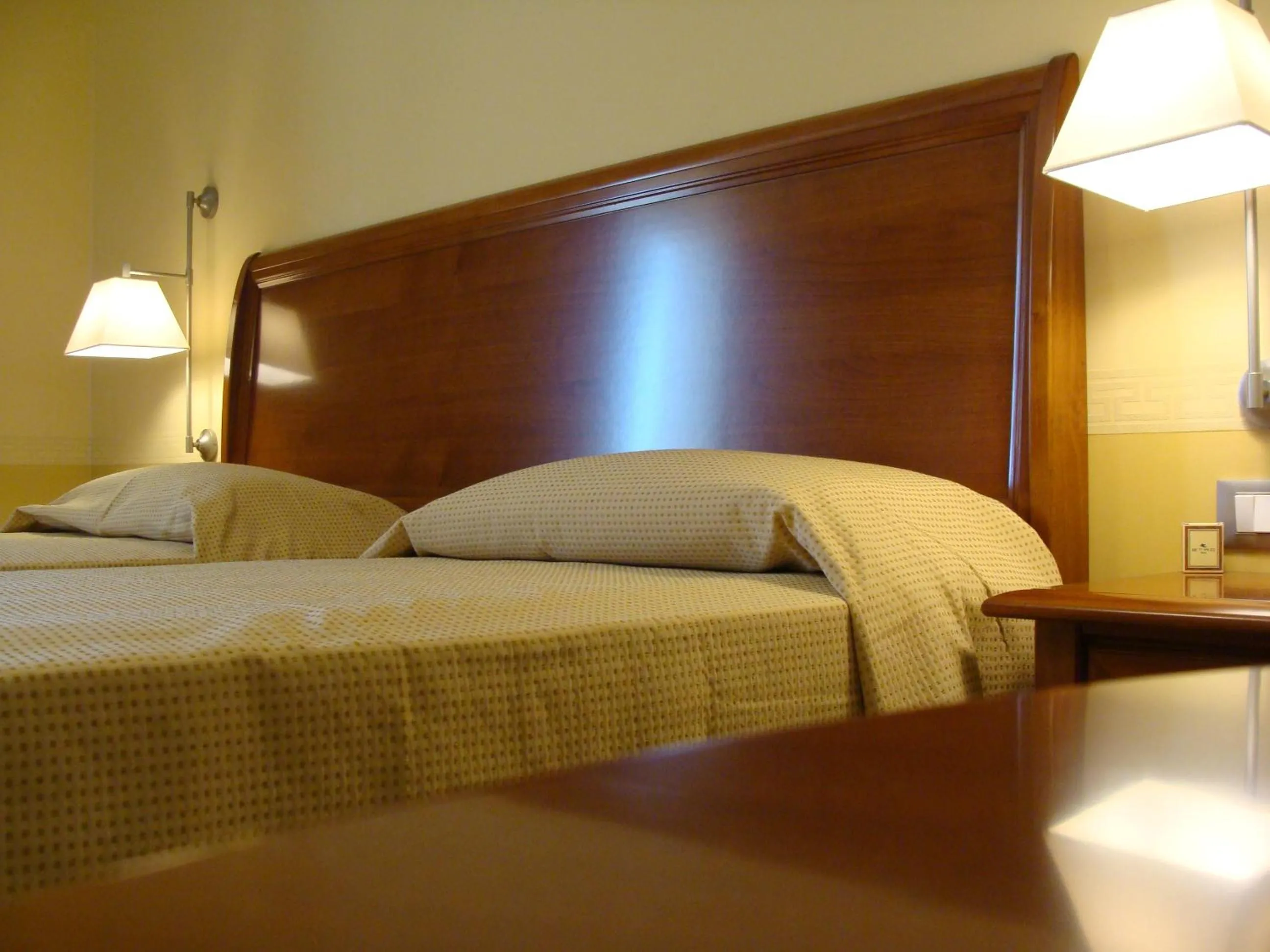 Bed in HOTEL L' ANFORA