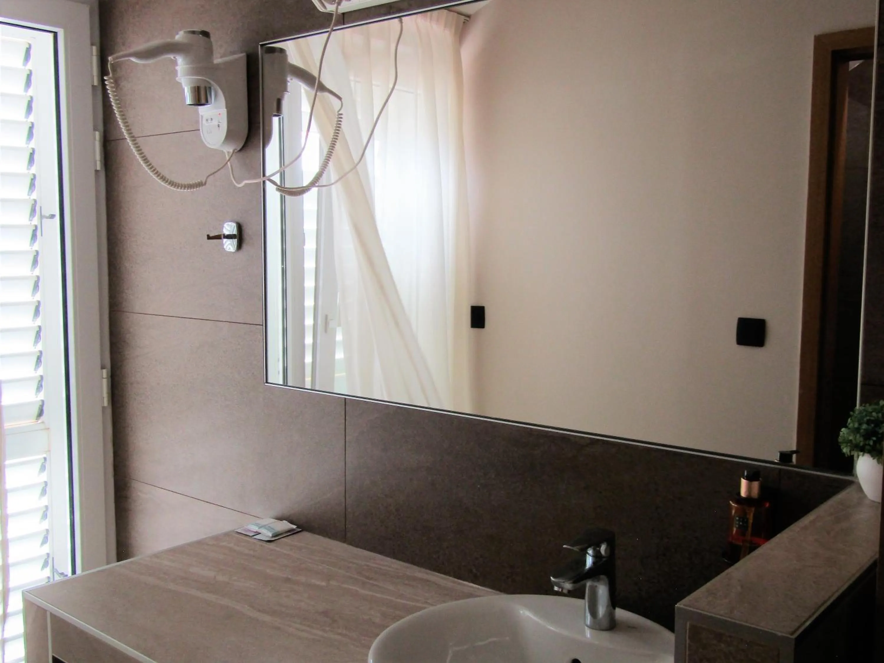 Bathroom in Beach Hotel Božikovina