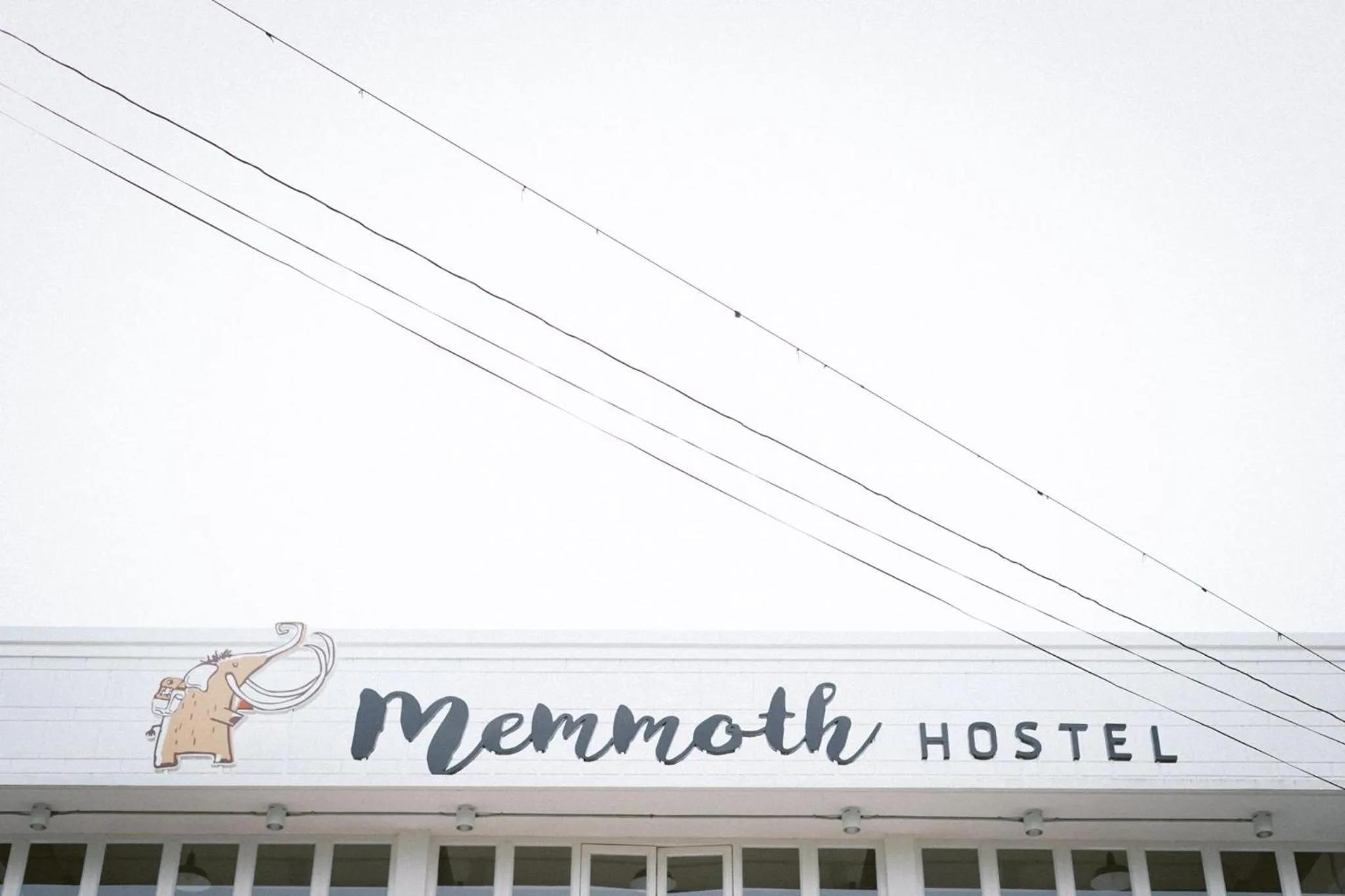 Property logo or sign in Memmoth Hostel In Lampang