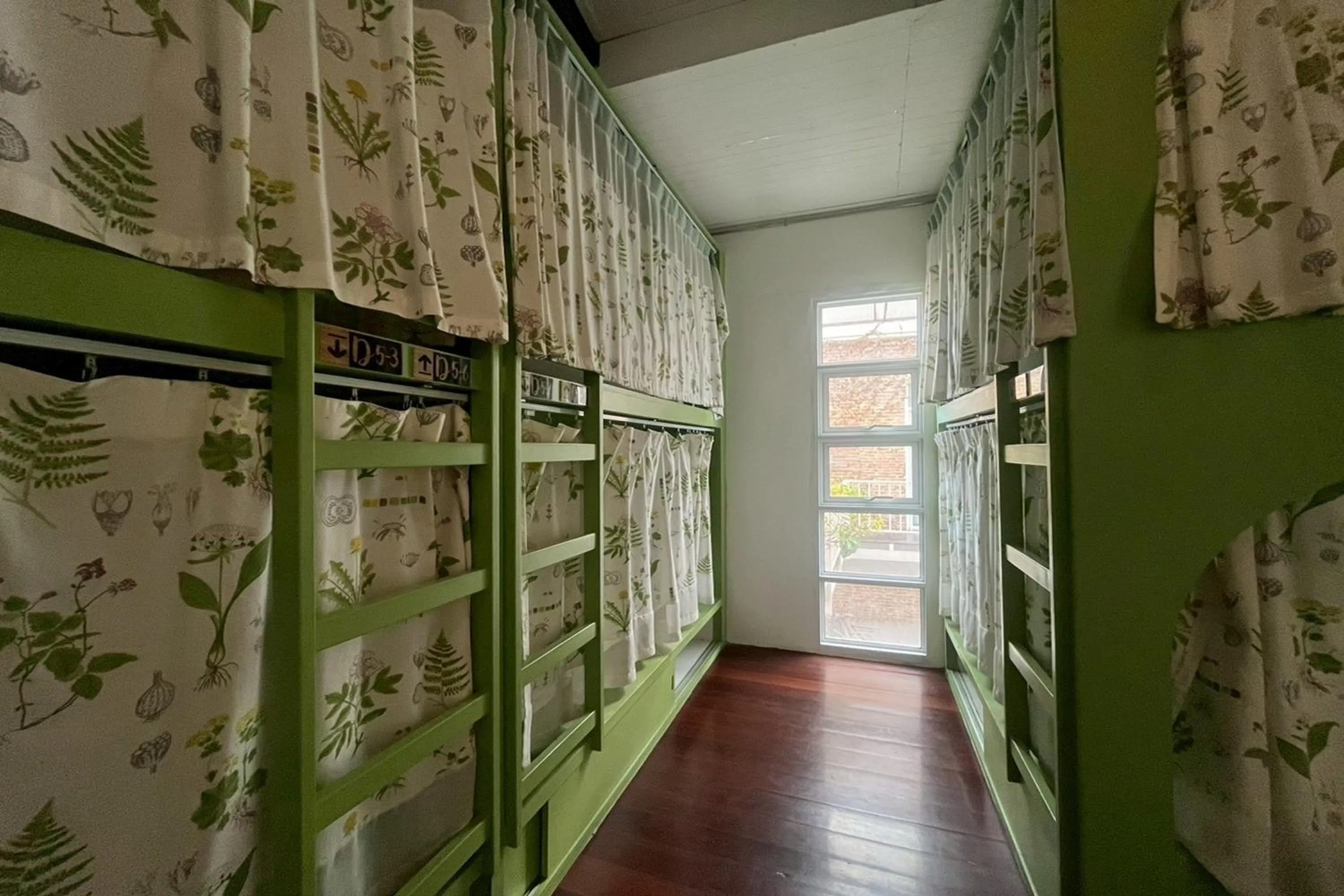 Photo of the whole room in Memmoth Cafe & Hostel in Lampang