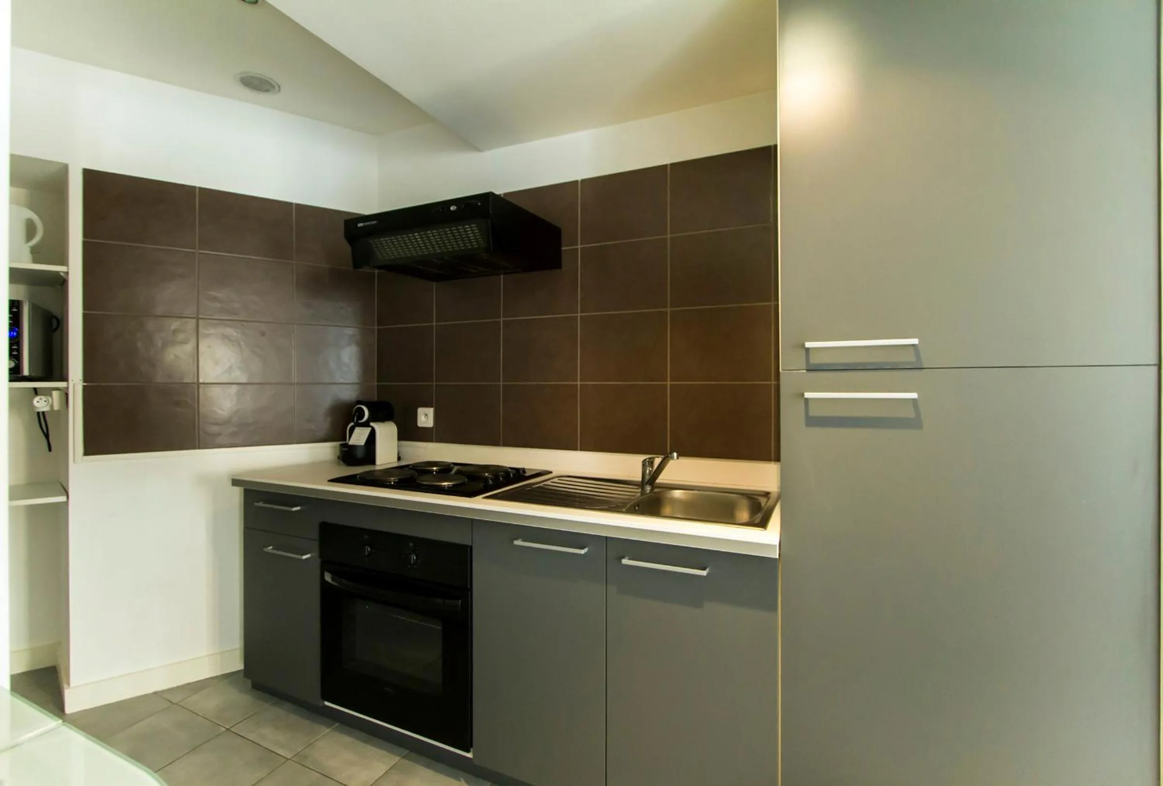 Kitchen or kitchenette in Florella Achard Apartment