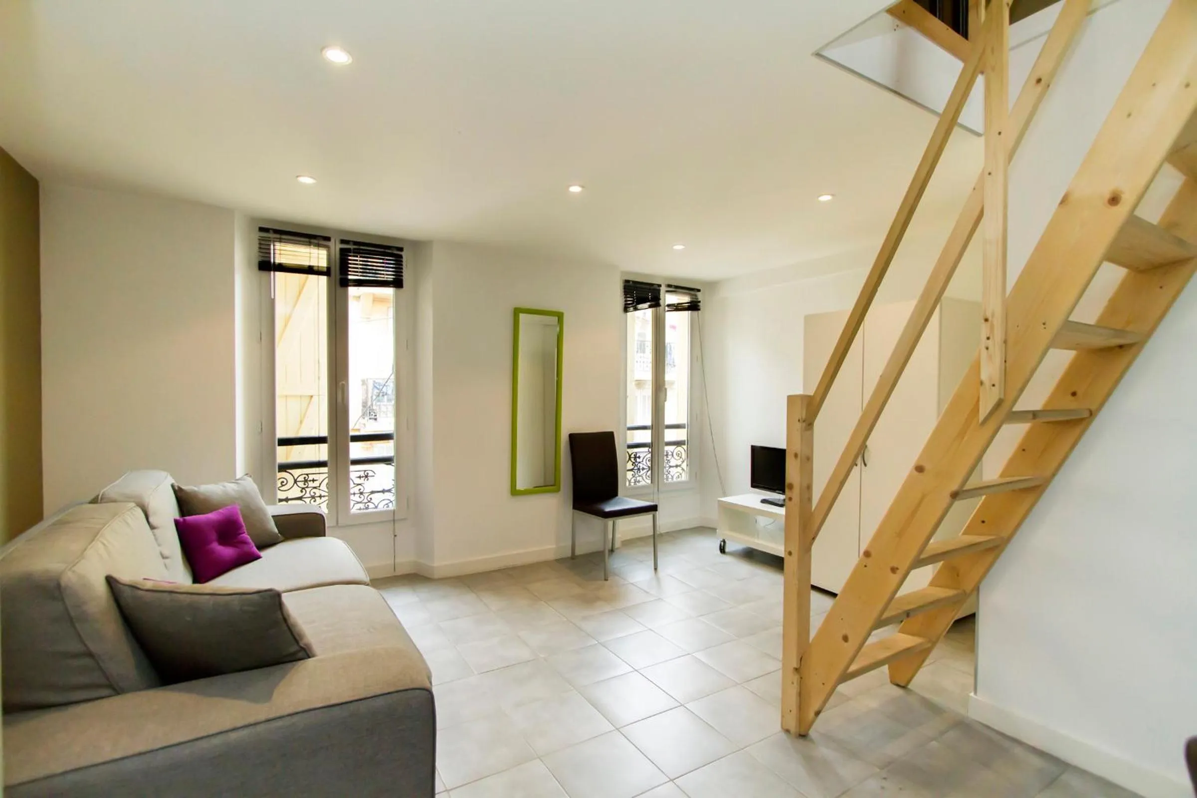 Communal lounge/ TV room in Florella Achard Apartment