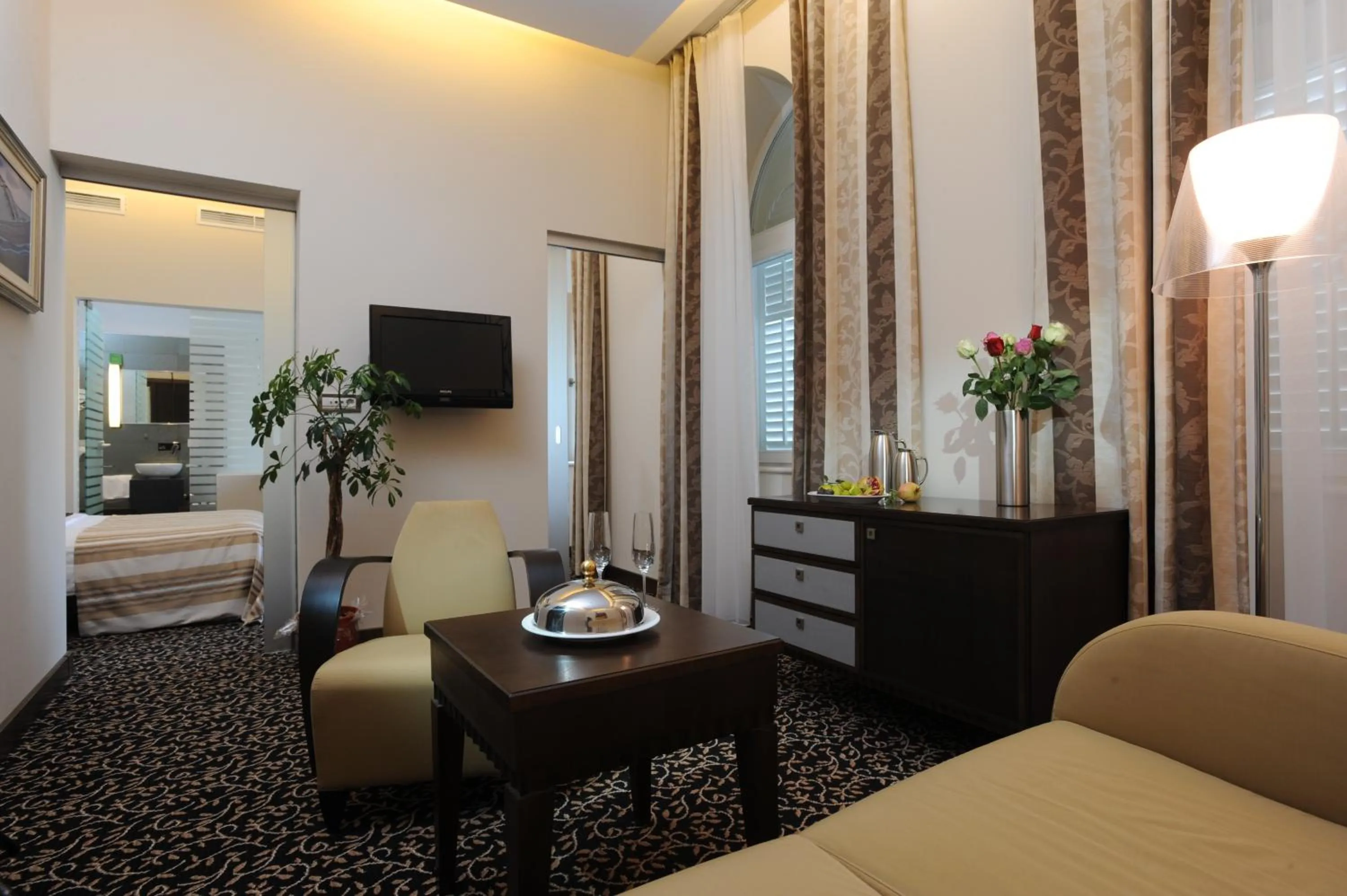 Seating area, Bed in Hotel Lapad