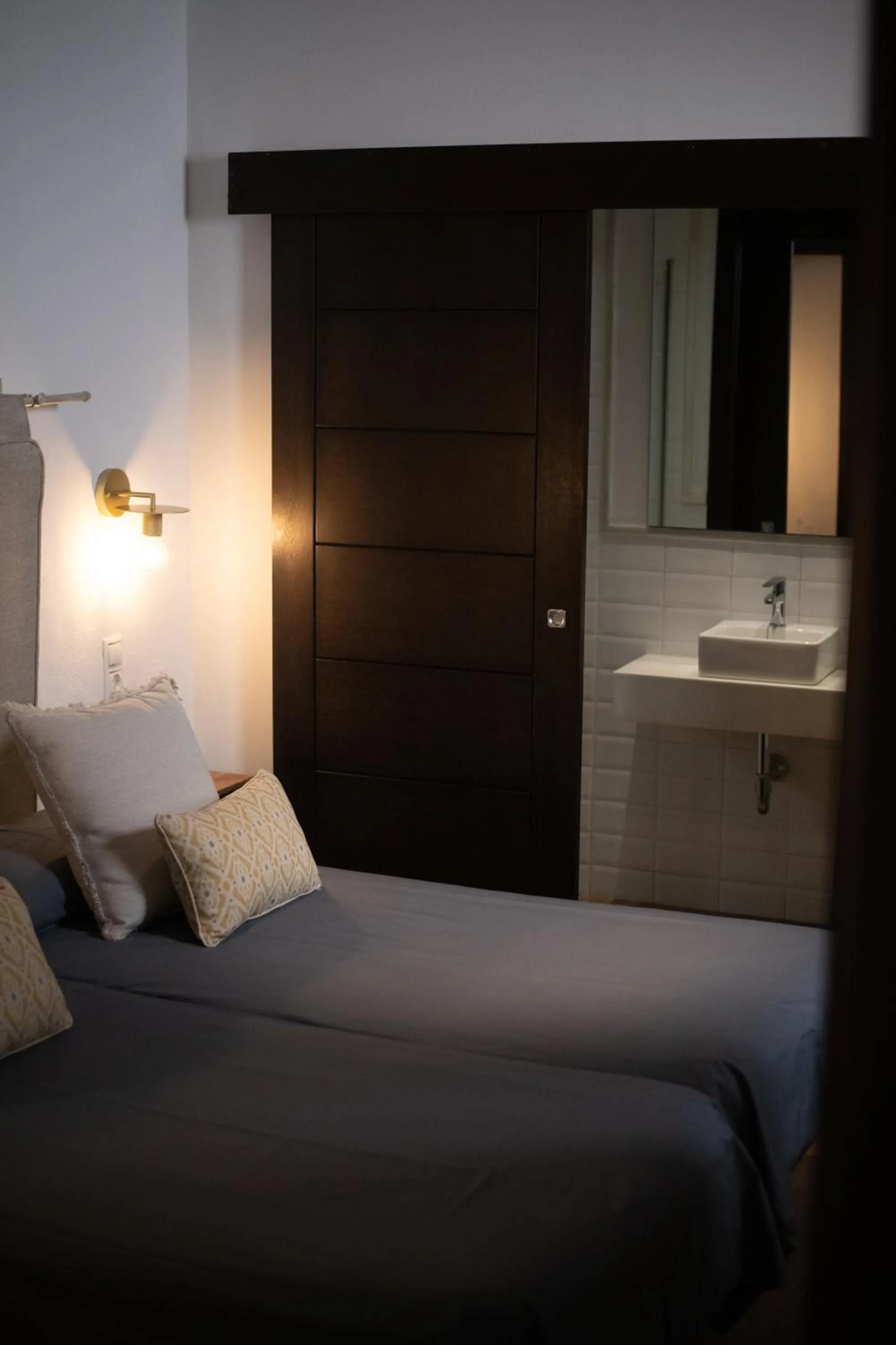 Bed in HOTEL BOUTIQUE ALMA ANDALUSí