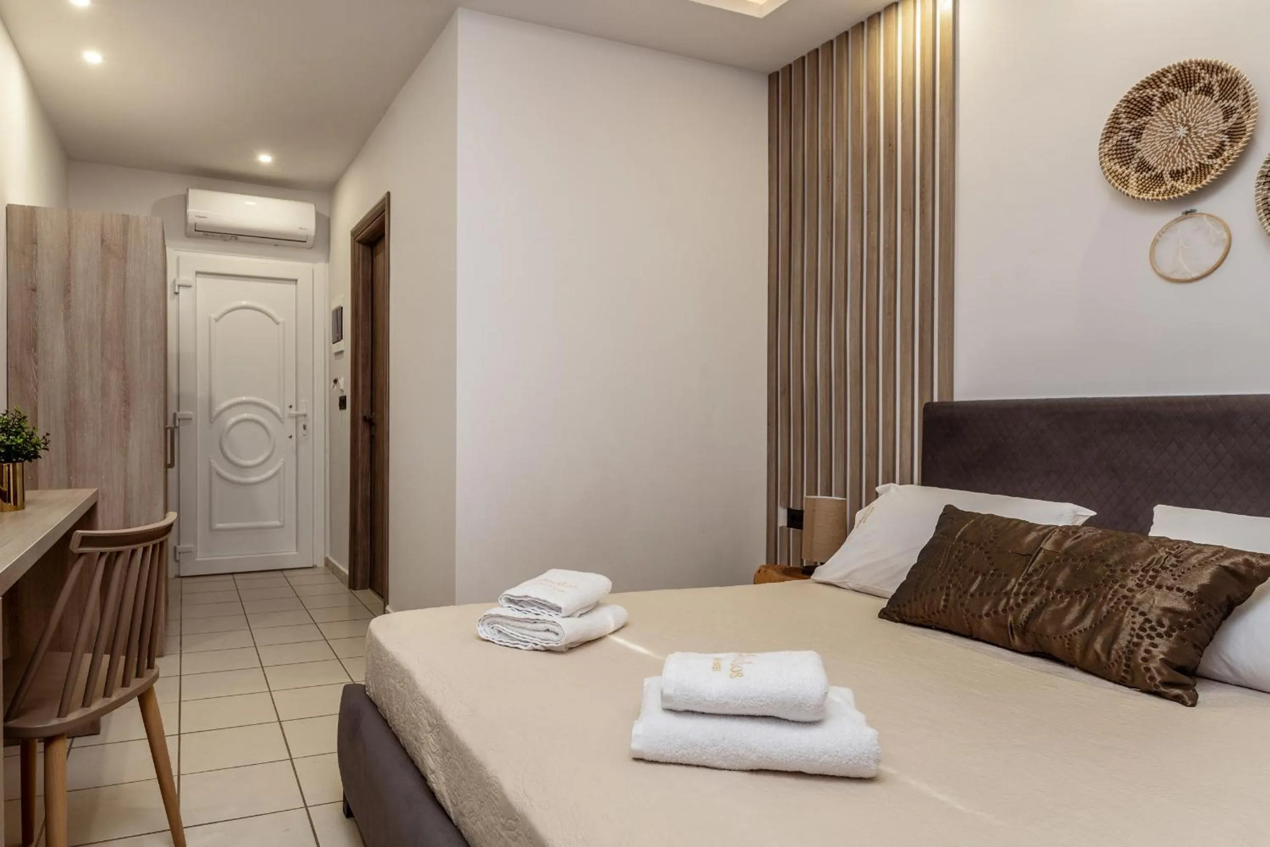 Bed in Aeolos Boutique Hotel & Suites