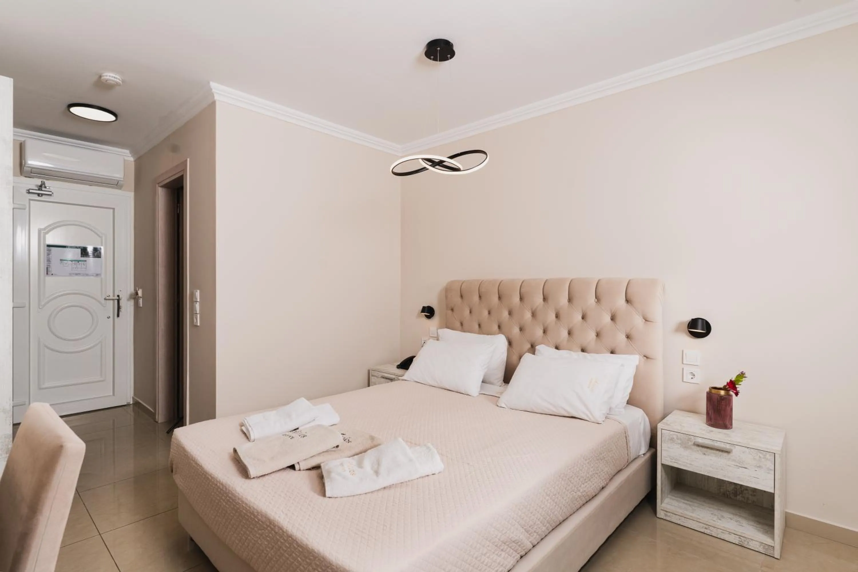 Bed in Aeolos Boutique Hotel & Suites