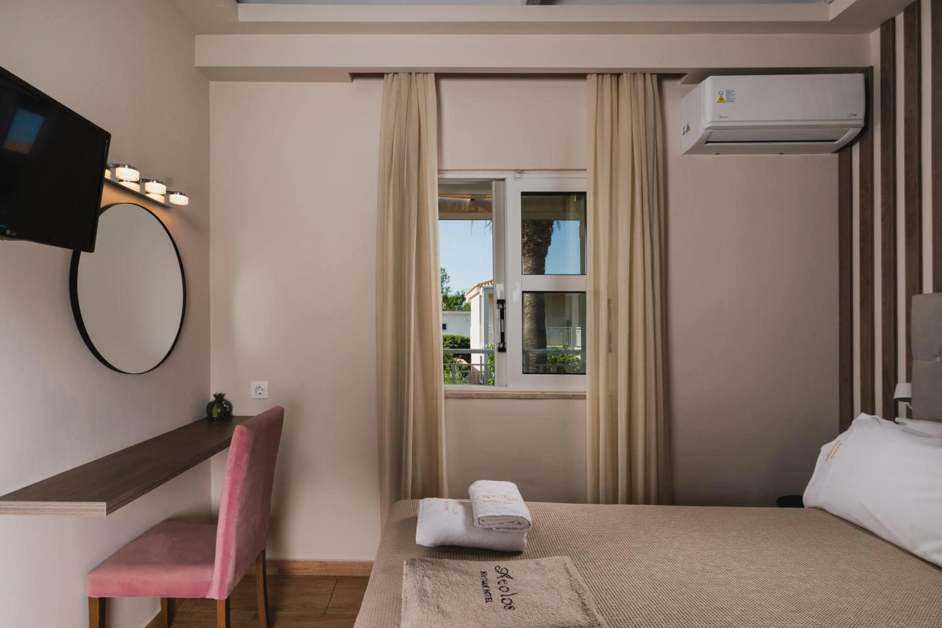 Bed in Aeolos Boutique Hotel & Suites