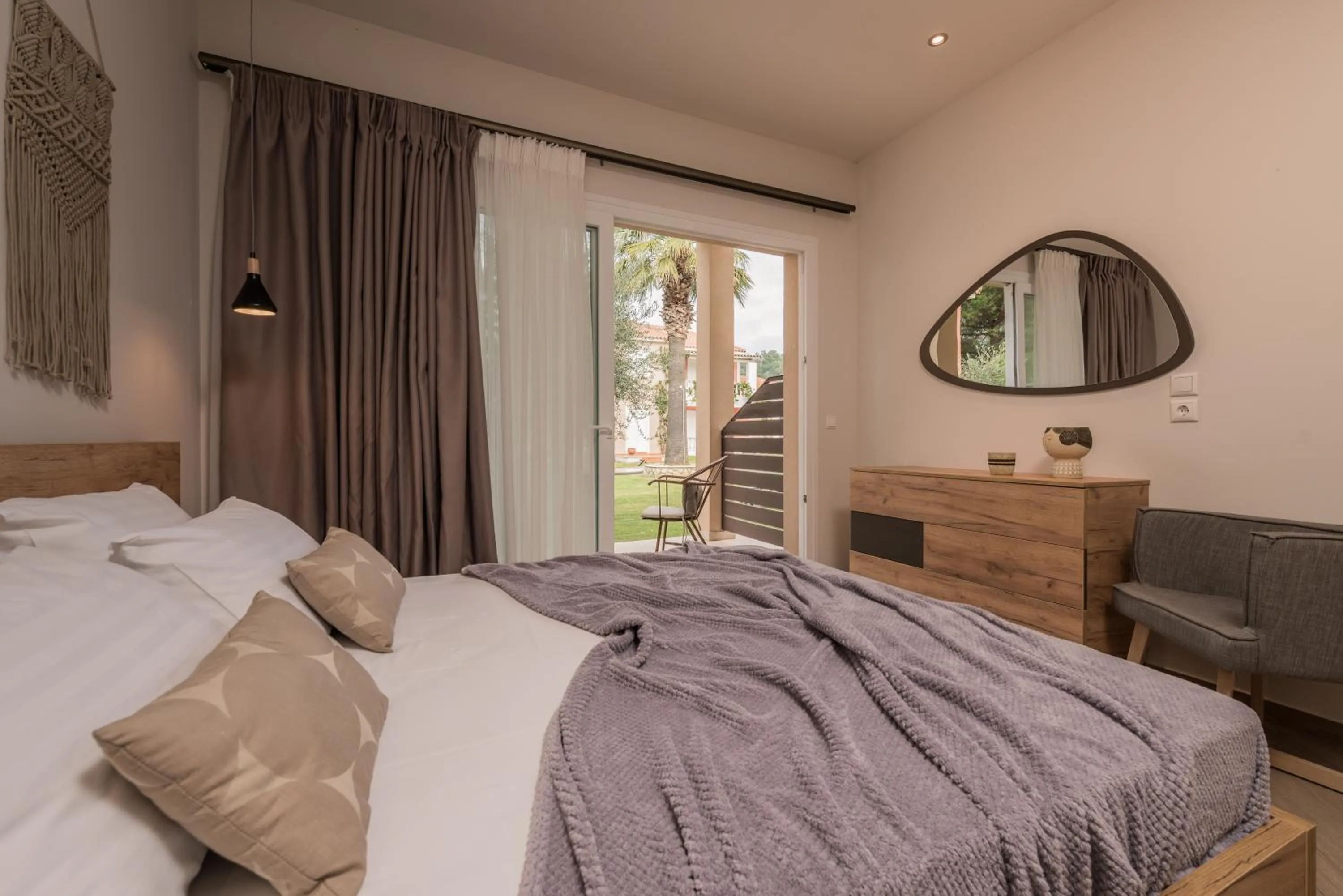 Bed in Aeolos Boutique Hotel & Suites