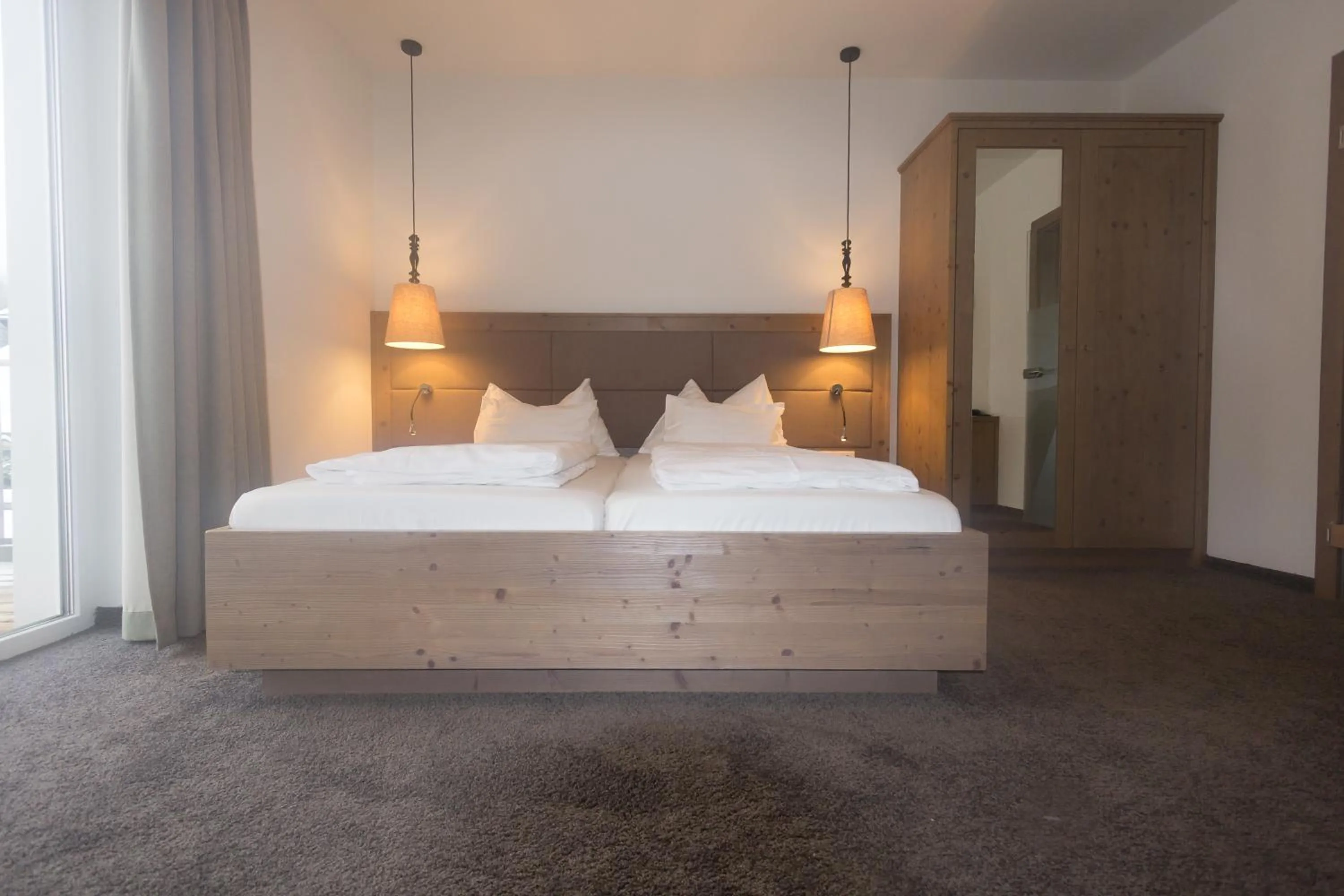 Photo of the whole room, Bed in Hotel Stadler am Attersee