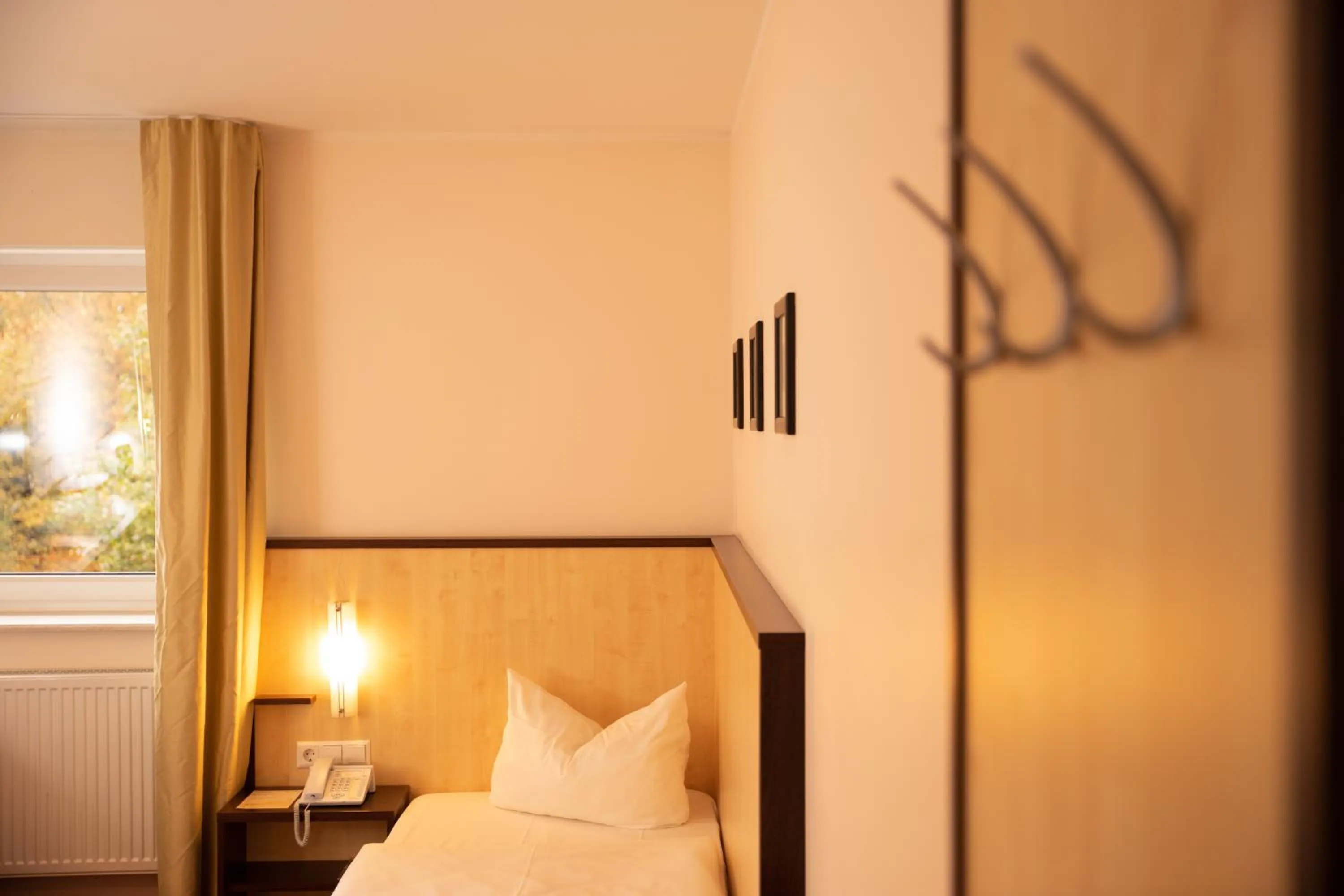 Photo of the whole room, Bed in Bergwirtschaft Wilder Mann Hotel und Restaurant