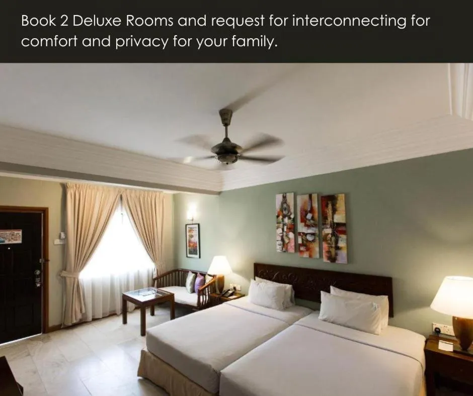 Bed in Frangipani Langkawi Resort