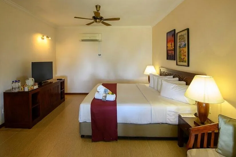 Bed in Frangipani Langkawi Resort