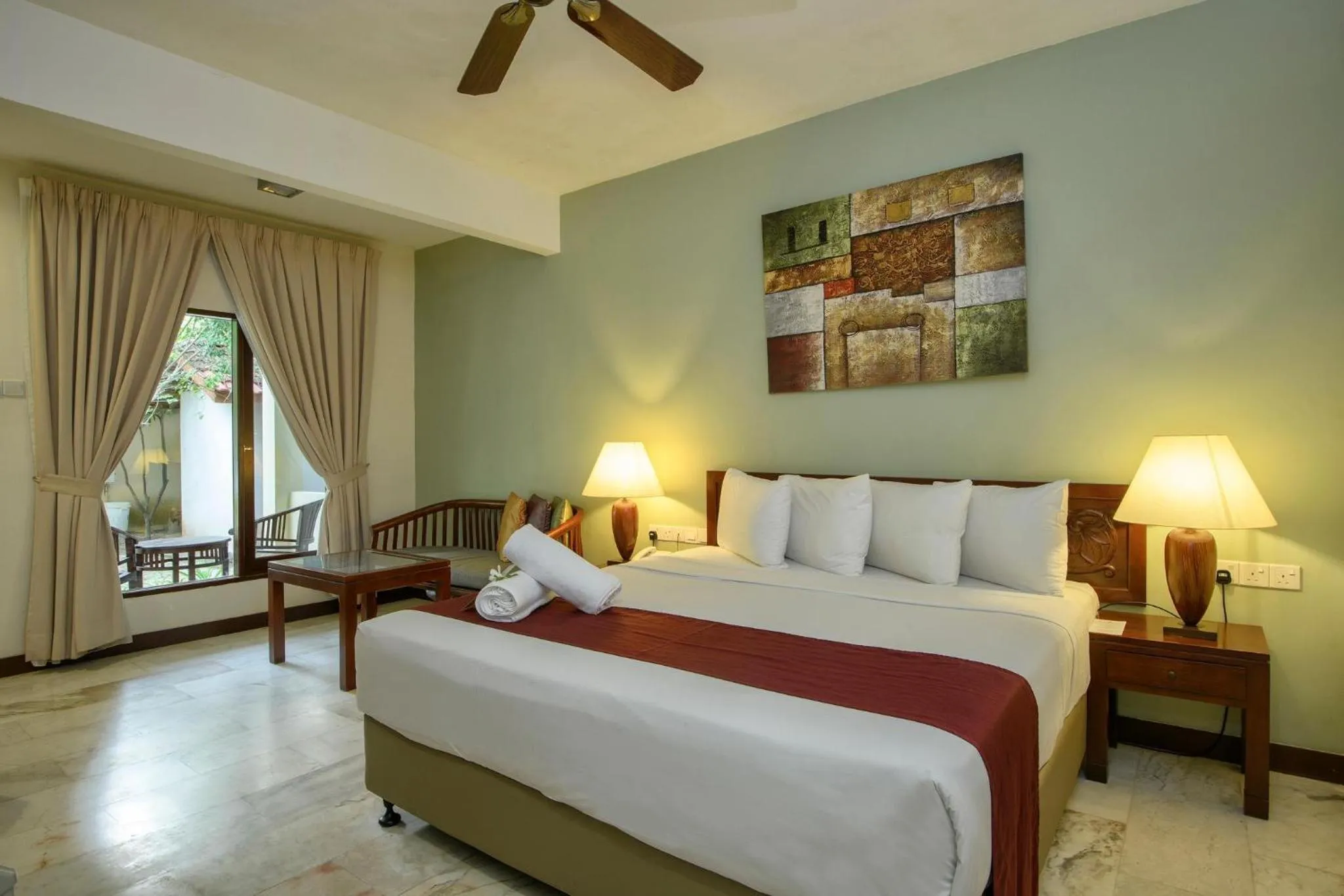 Bed in Frangipani Langkawi Resort