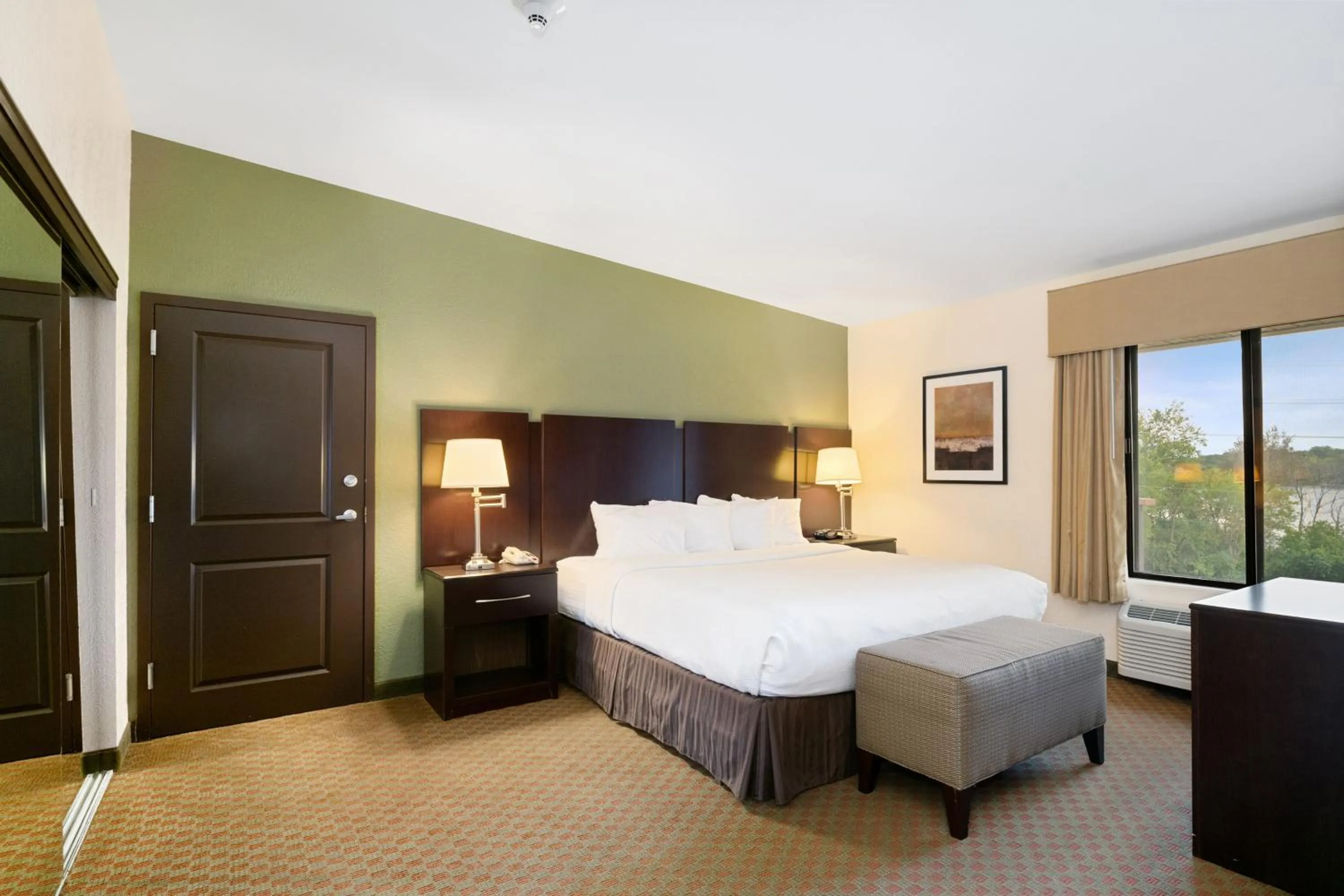 Bed in Antioch Hotel & Suites