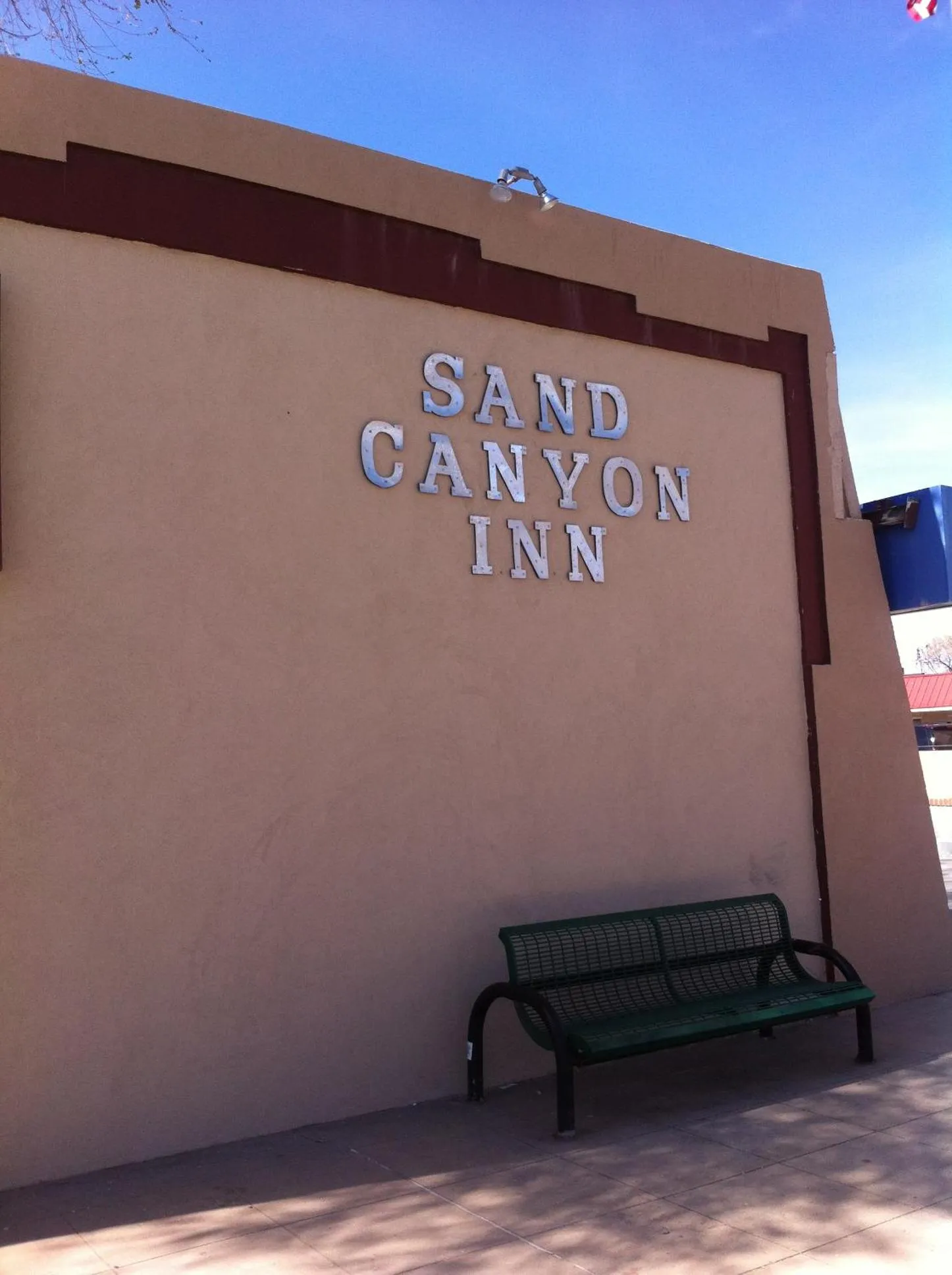 Property logo or sign in National 9 Inn Sand Canyon