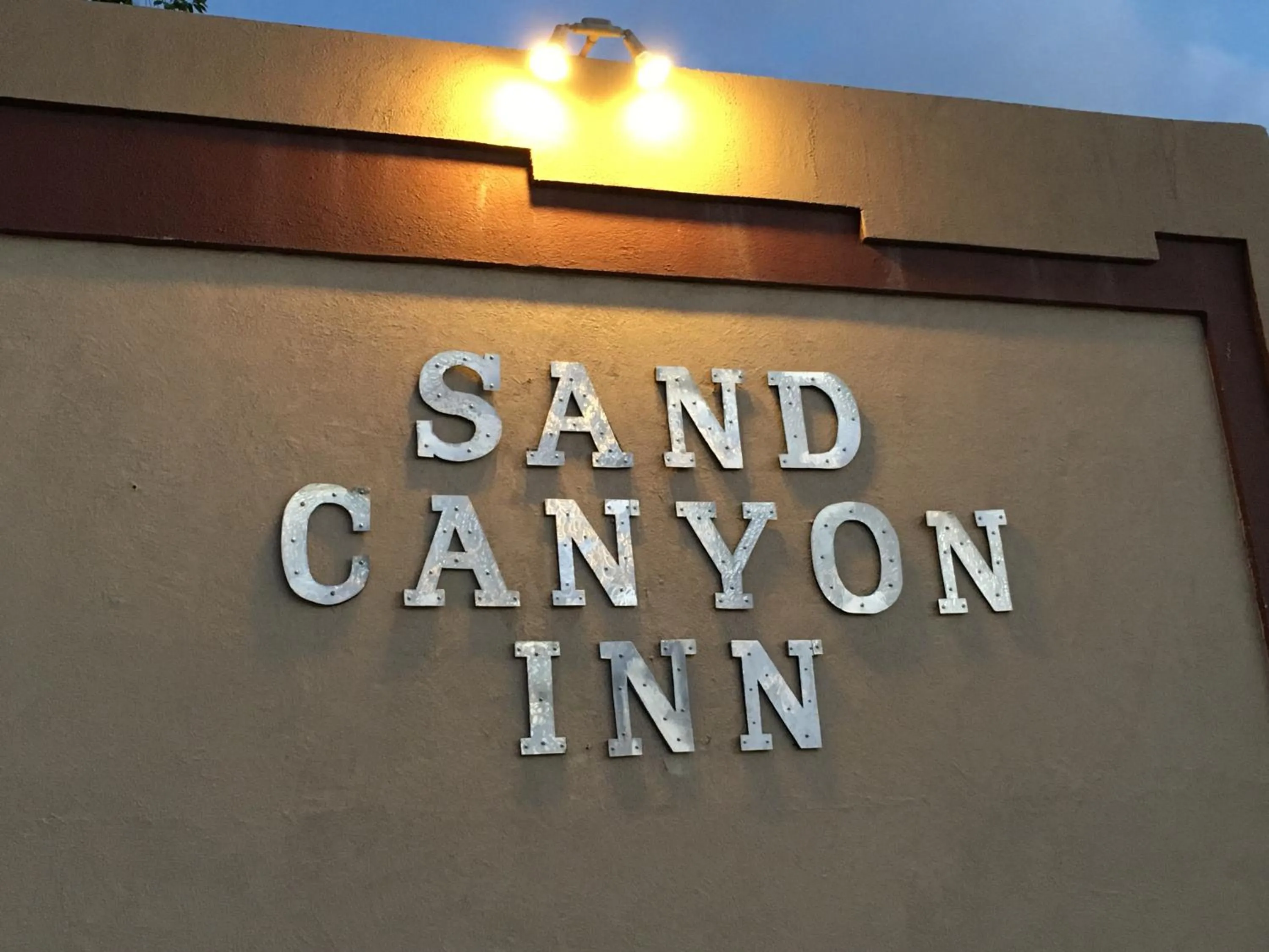Property logo or sign in National 9 Inn Sand Canyon
