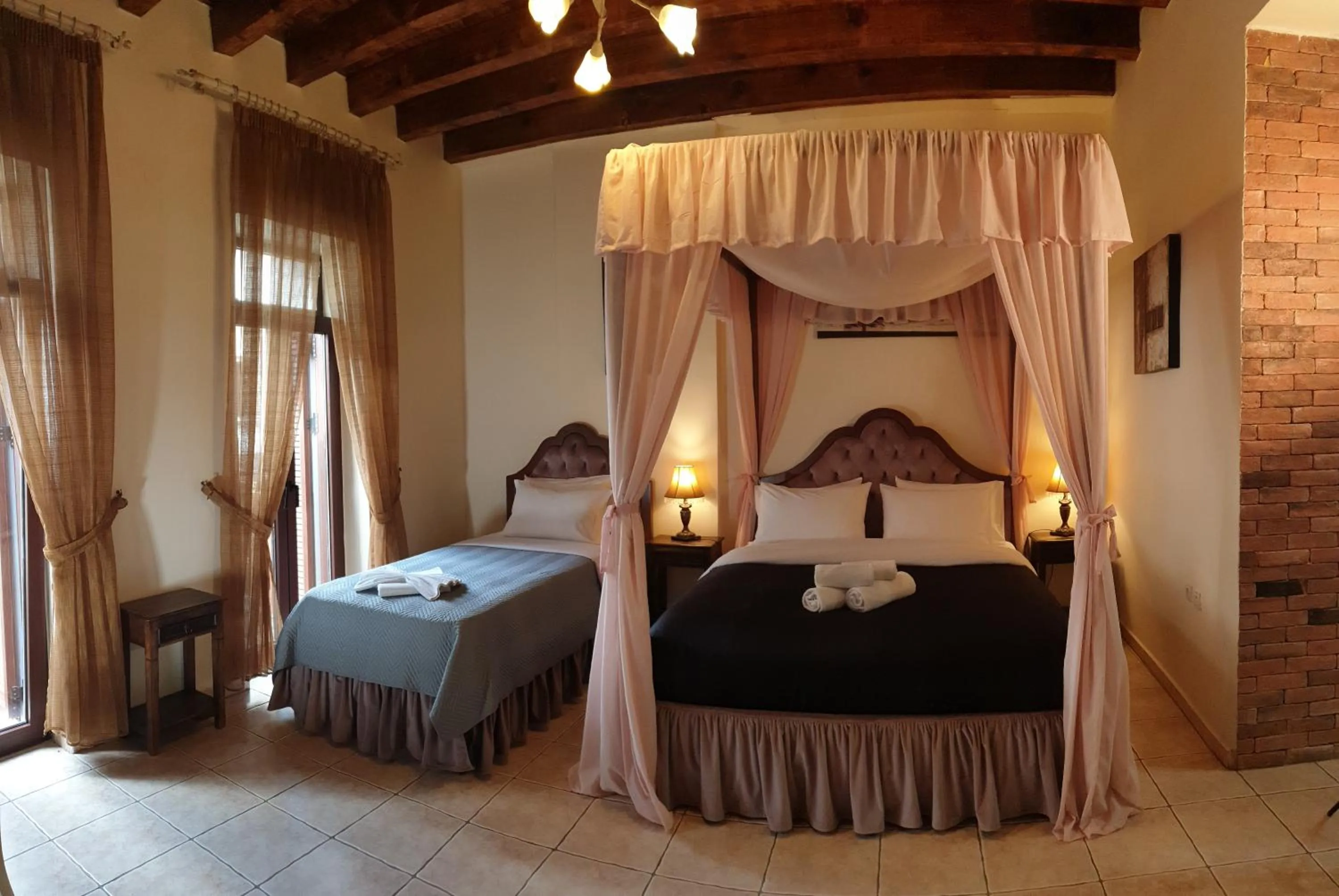 Bed in Odos Oneiron Boutique Hotel