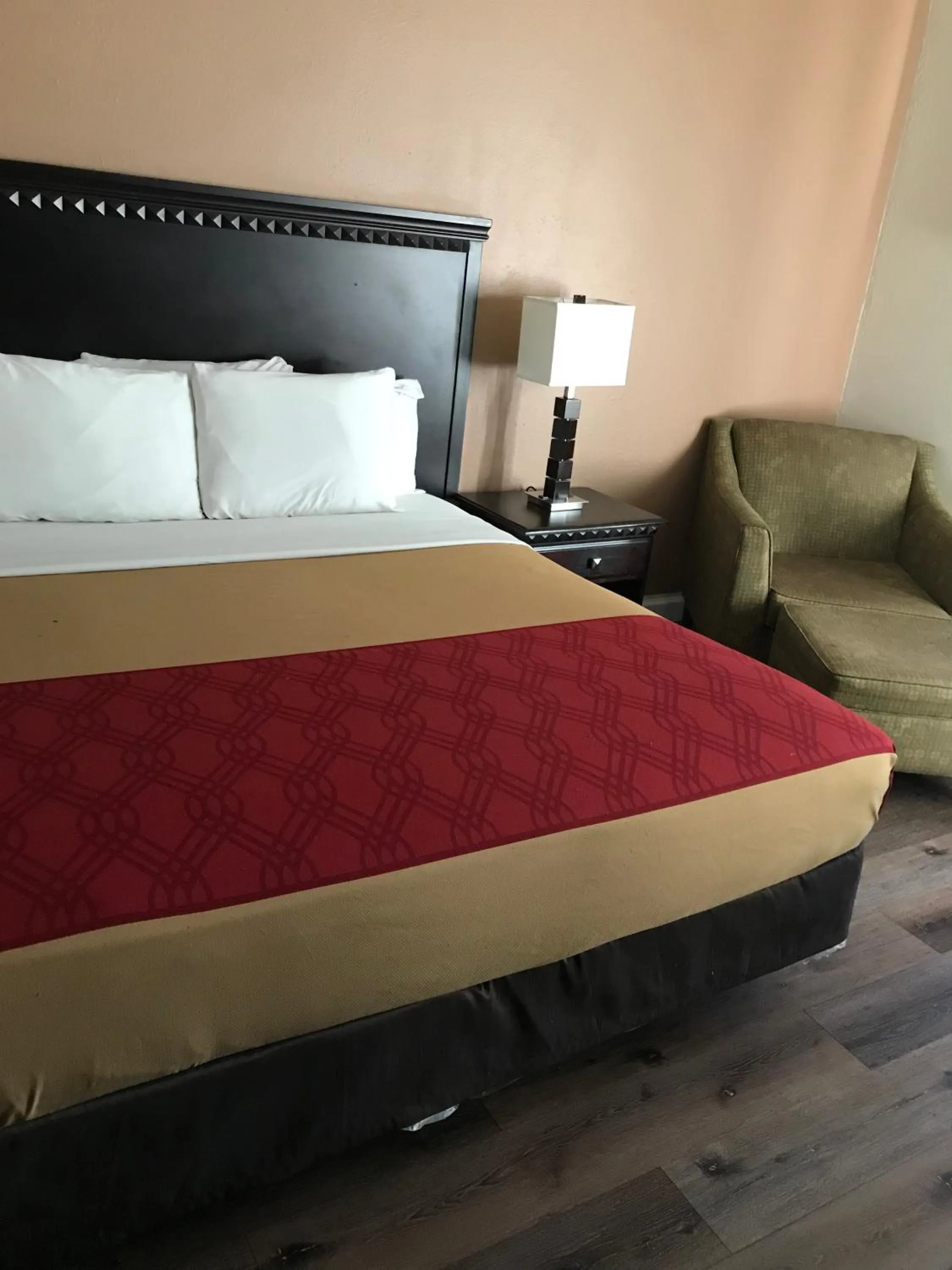 Bed in The Best Inn & Suites