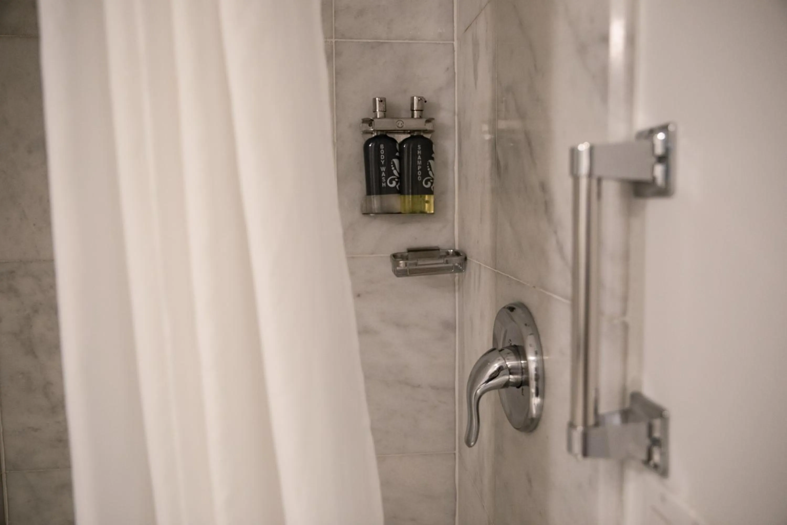 Shower in The Historic Blue Angel Hotel Lexington Ave, an Ascend Collection
