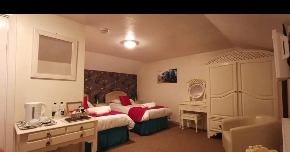 Bed in The Jug & Glass Inn