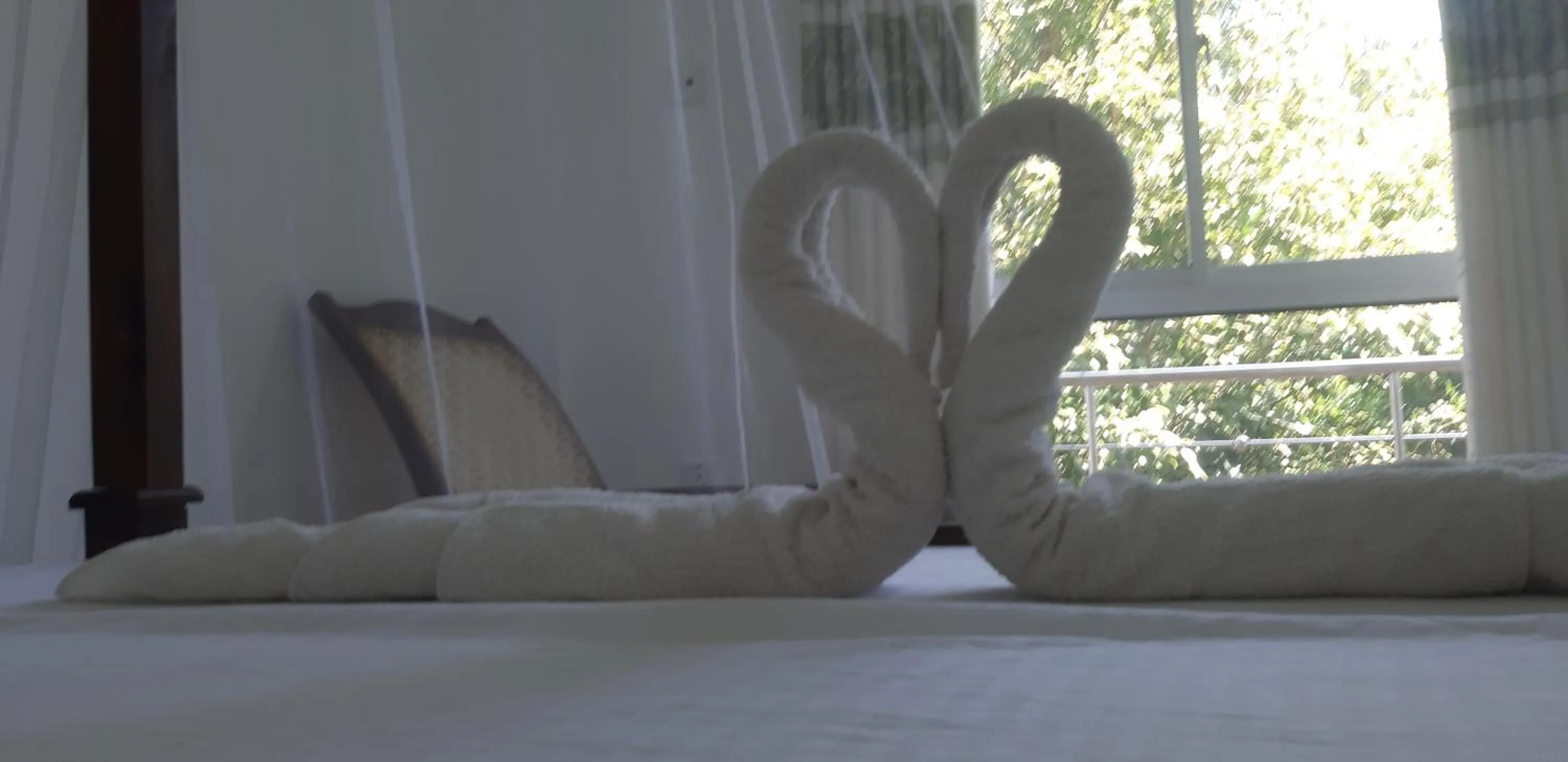 Bed in Butterfly Homestead Hotel