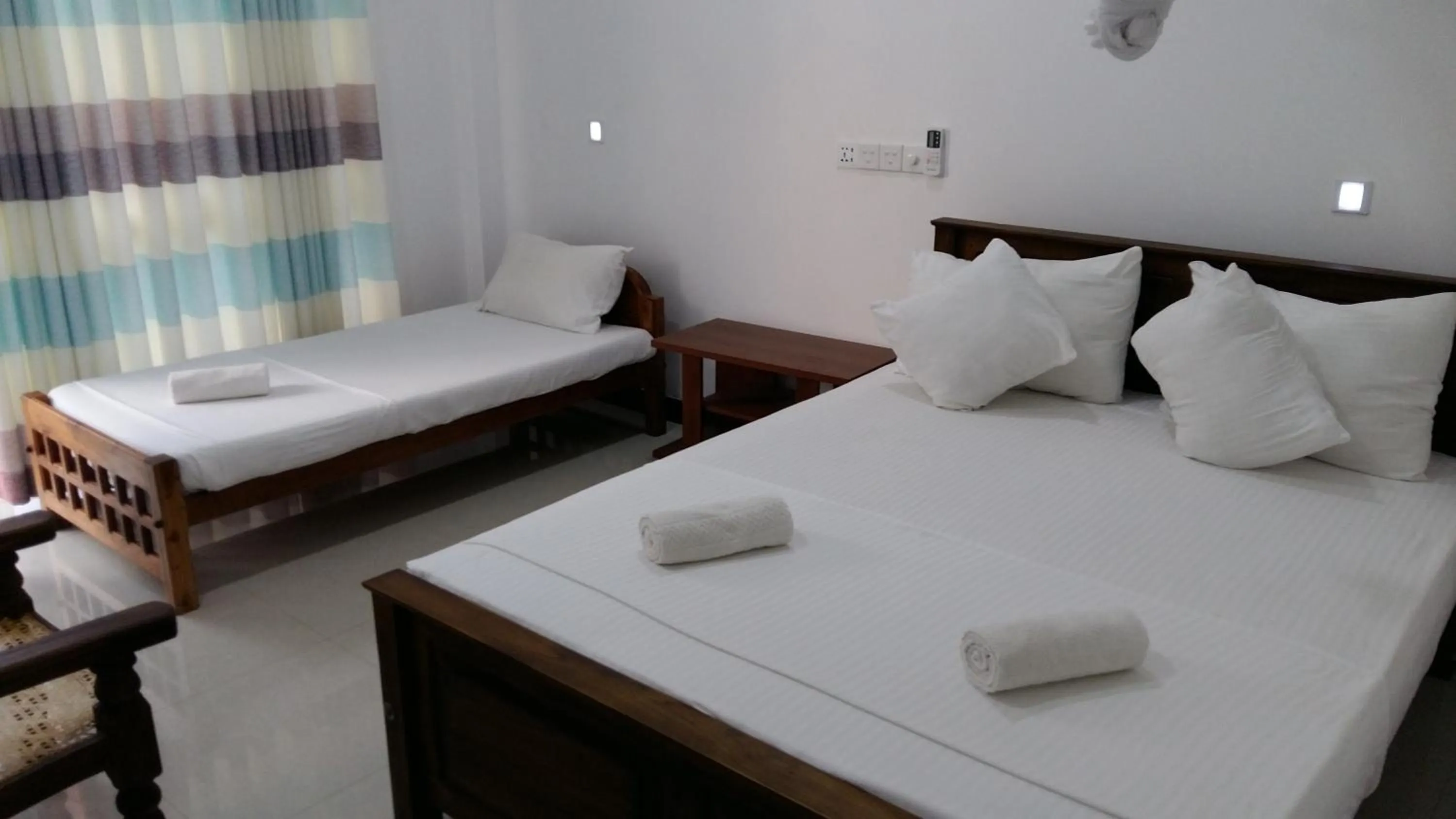 Bed in Butterfly Homestead Hotel