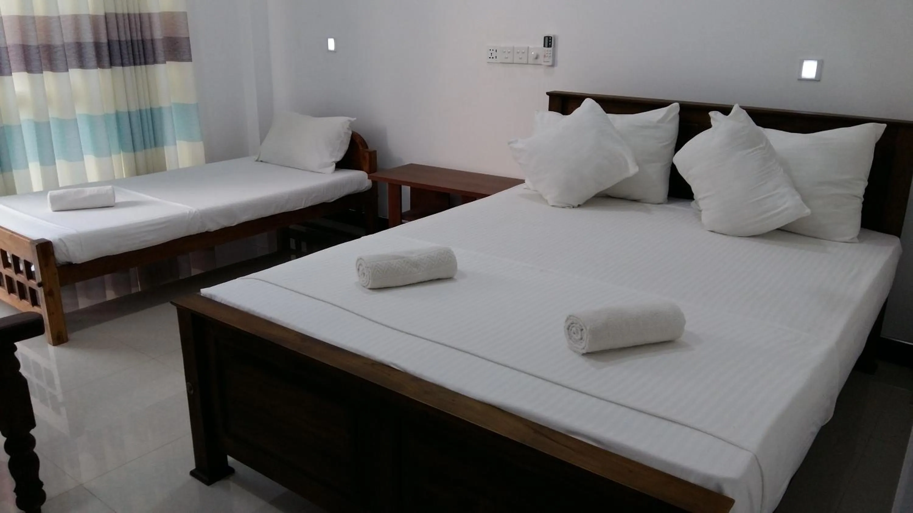 Bed in Butterfly Homestead Hotel